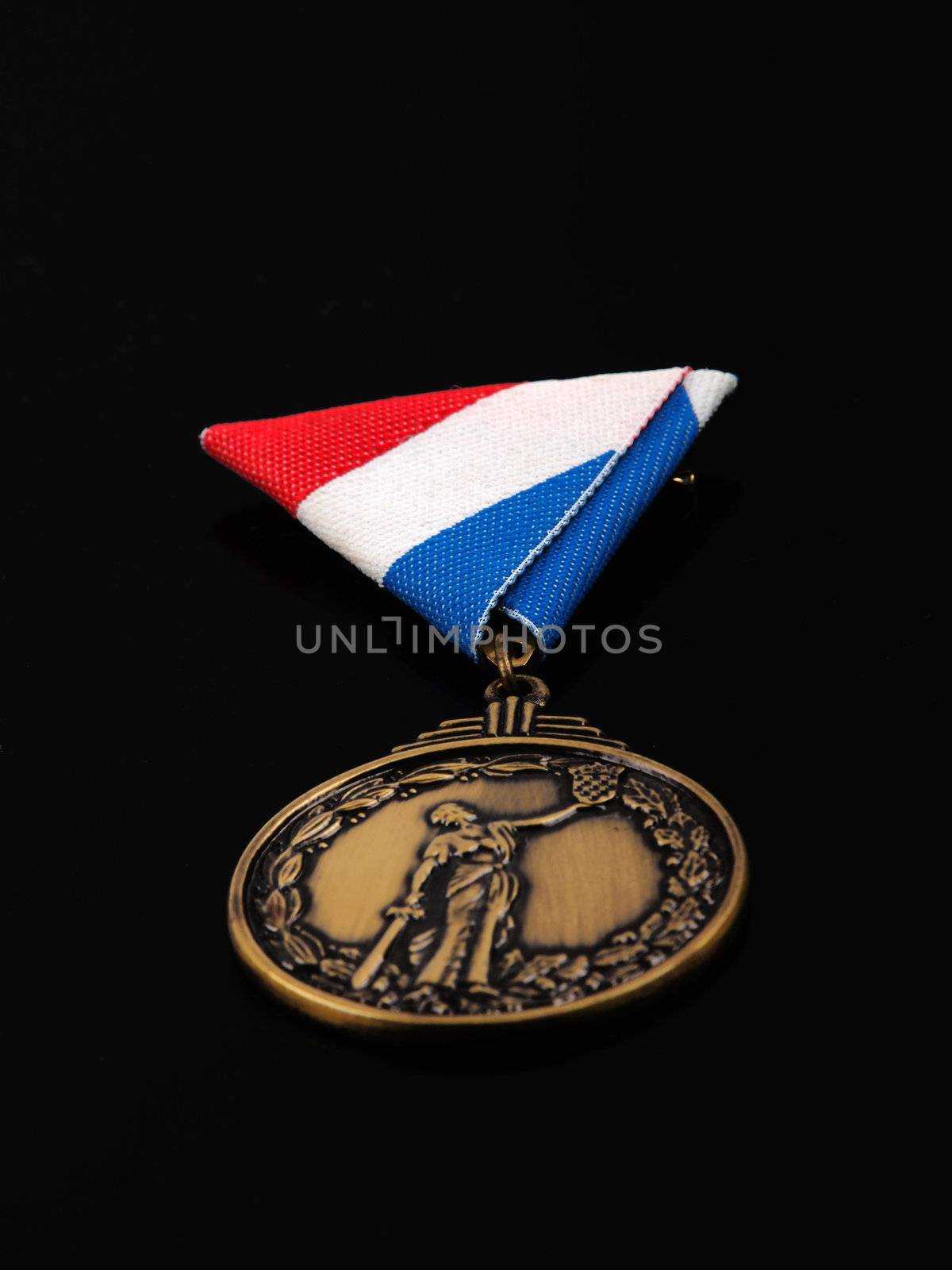 bronze medal for war heroes; isolated on black background         