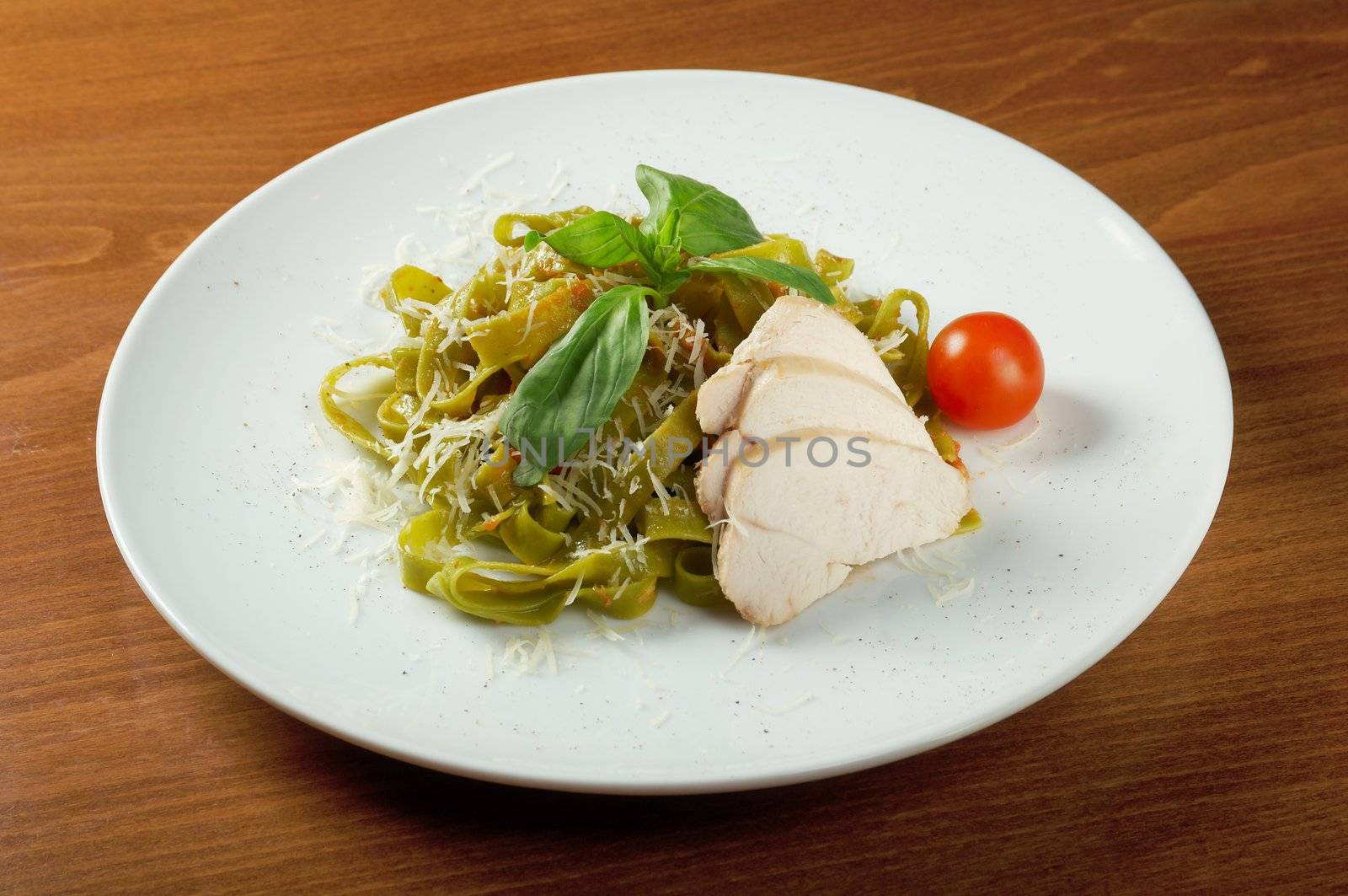 Pasta tagliatelle with pesto sauce basil and grated parmesan