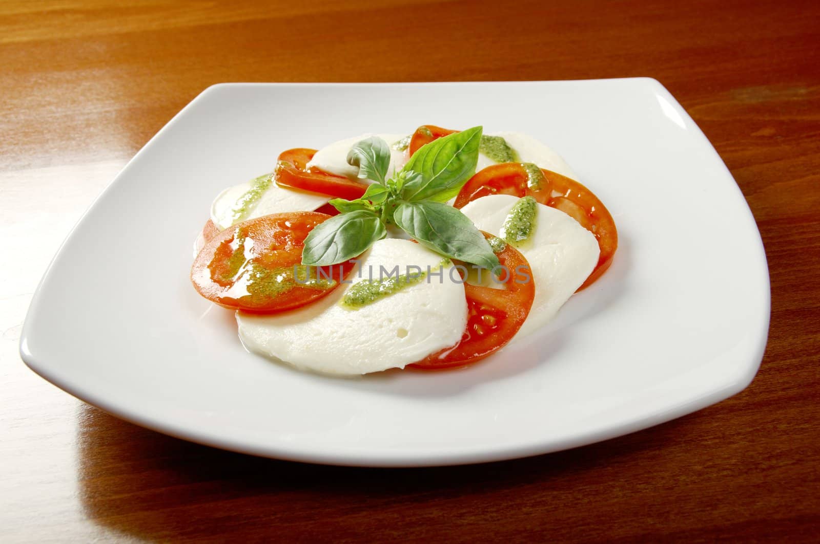 Italian cuisine.Arrangement of mozzarella and tomatoes