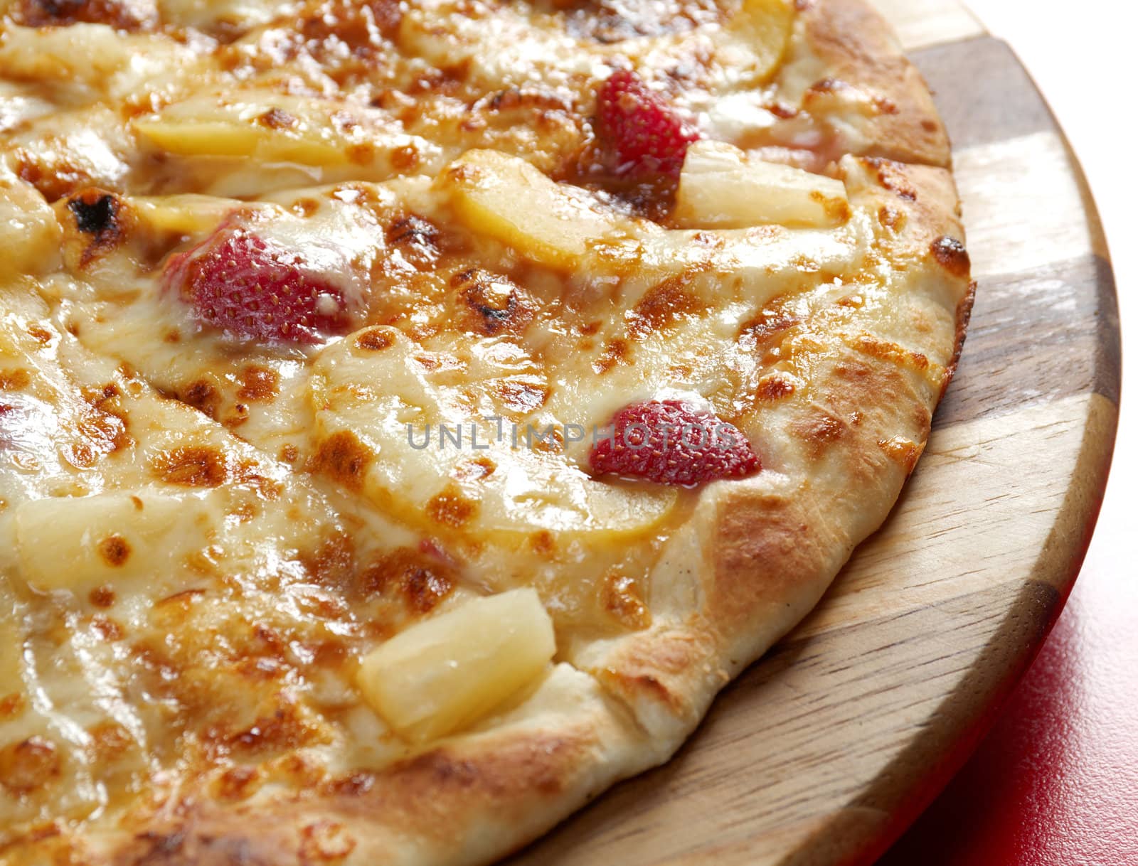 Pizzasweet with strawberries. italian kitchen. Studio