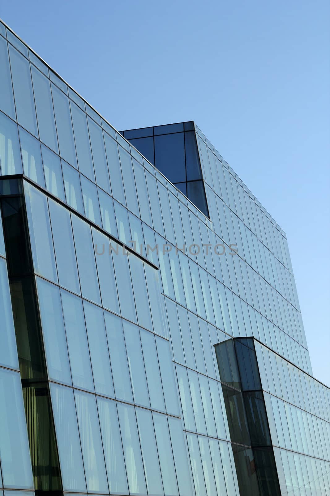 office building with glass wall detail by goce
