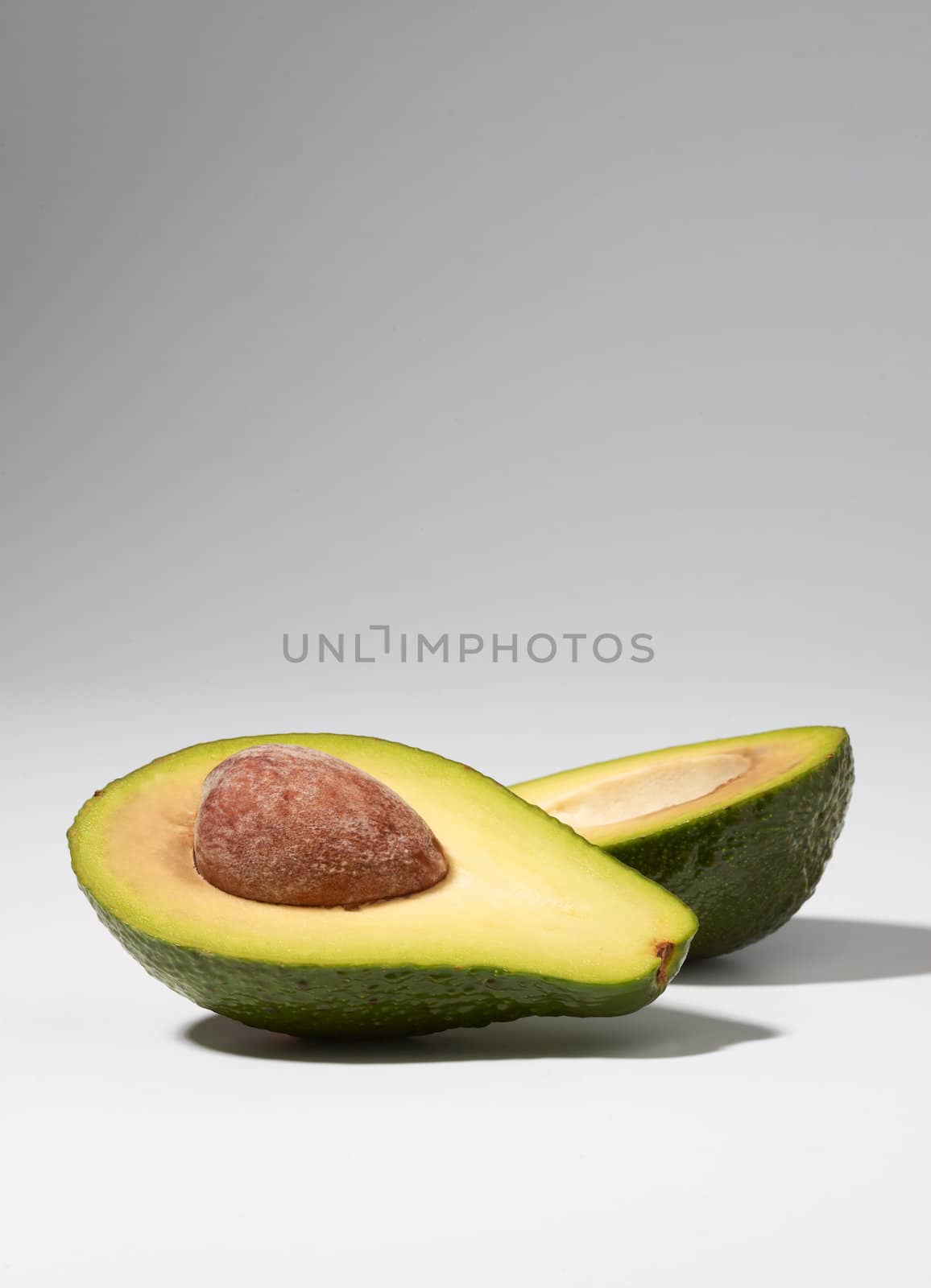 Close-up of cut avocado on white