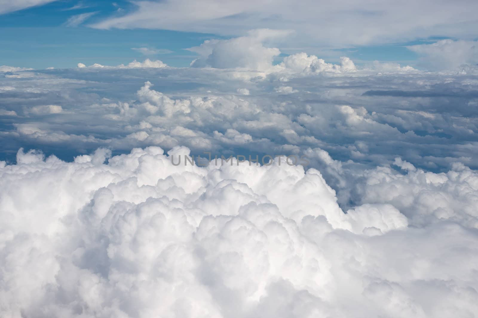 Aerial view on white fluffy clouds