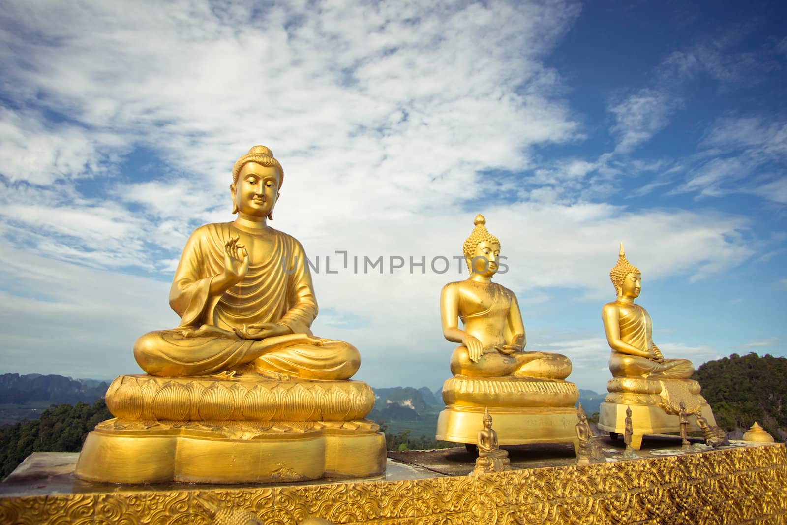 Three buddhas against the sky by timbrk