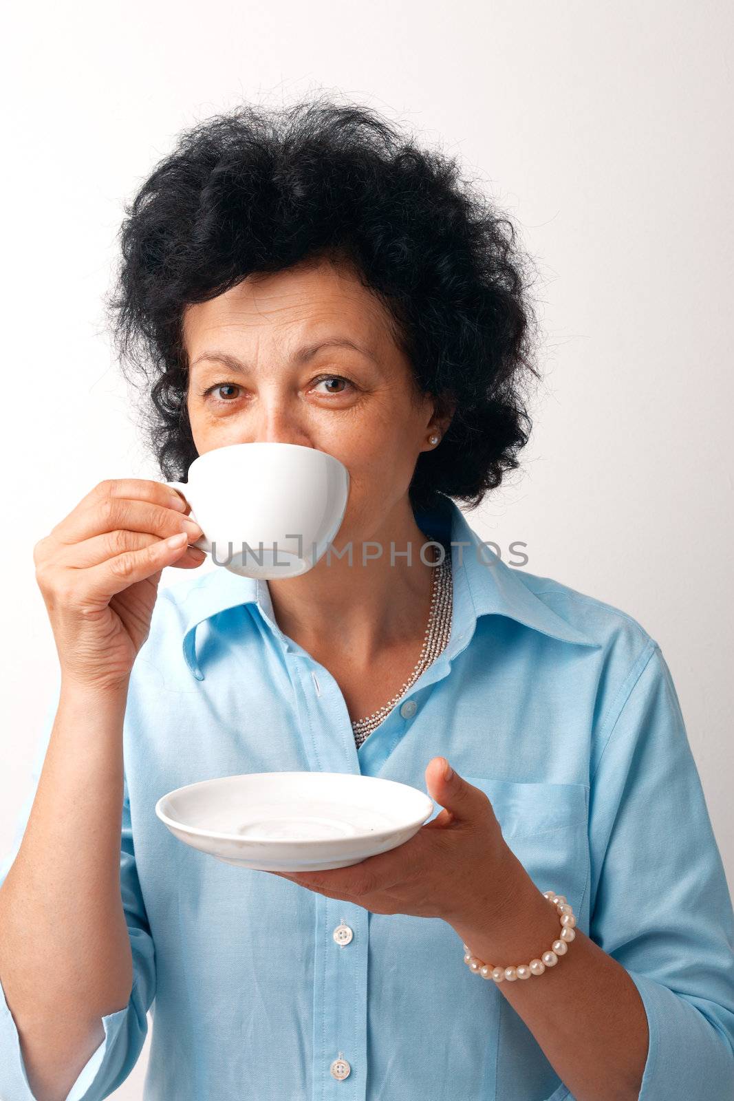 Elder Woman Drinking Tea. by romanshyshak