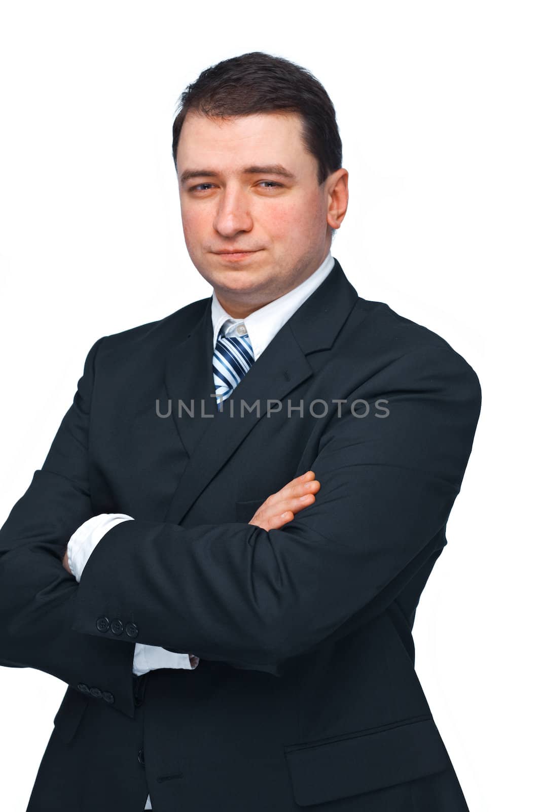 Portrait of a successful business man in a black suit with hands folded isolated over white 