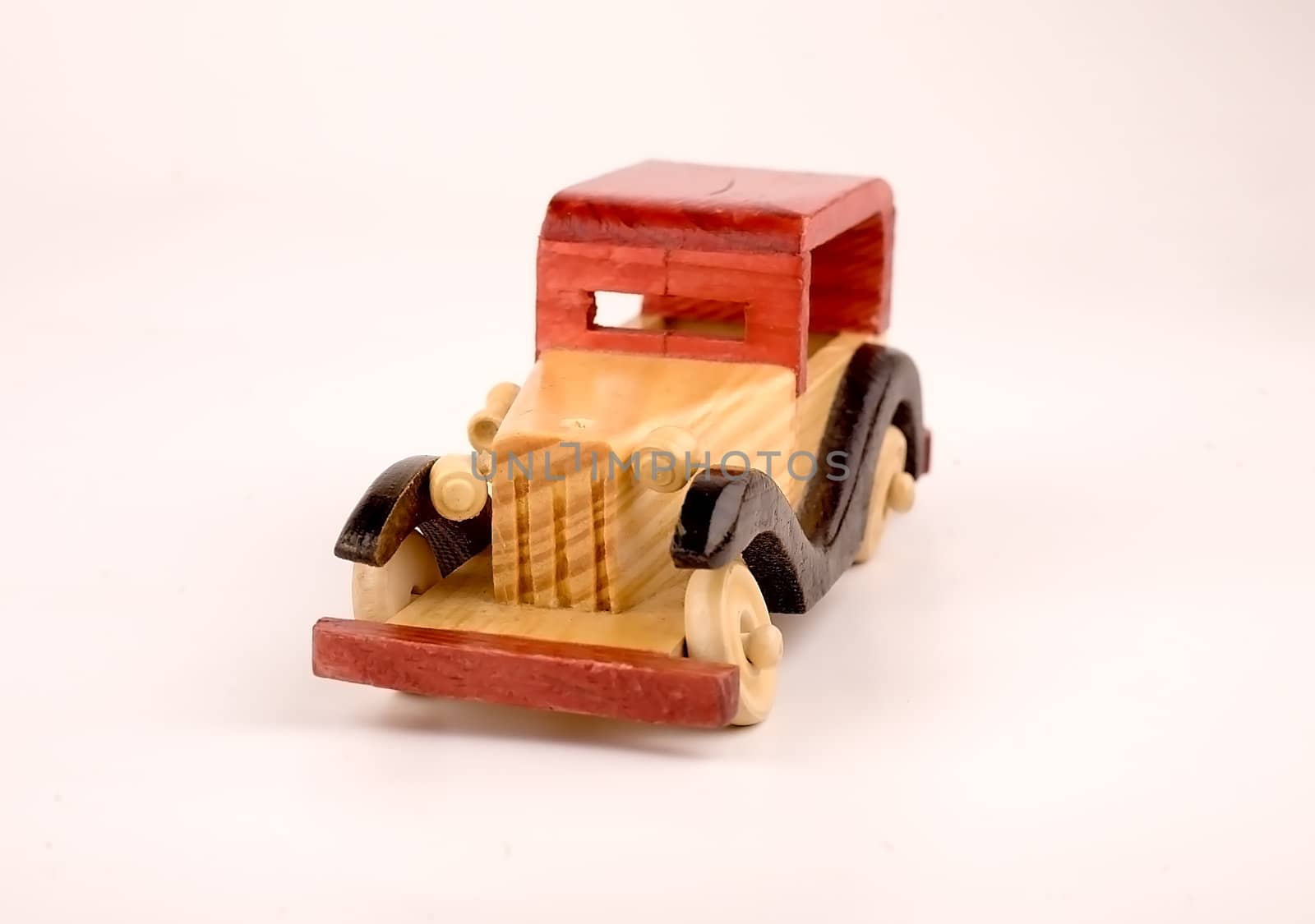 Children toy car made ??of wood, isolated on white background