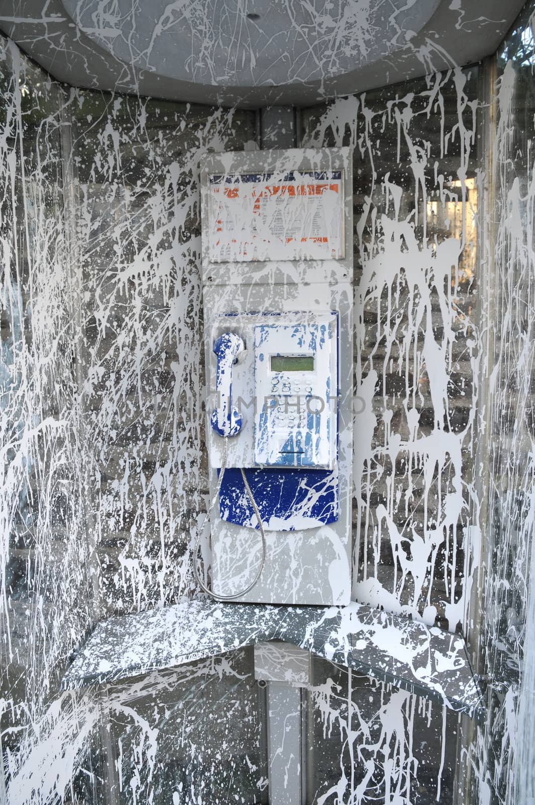 Public Telephone Cabin Vandalized with White Paint