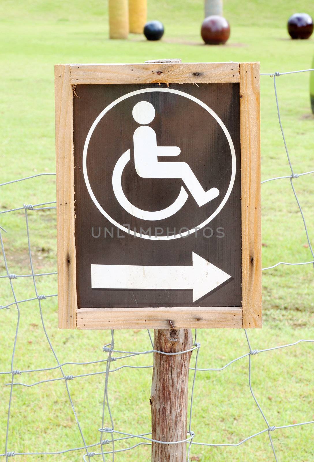 wood sign for invalid person entry in the park