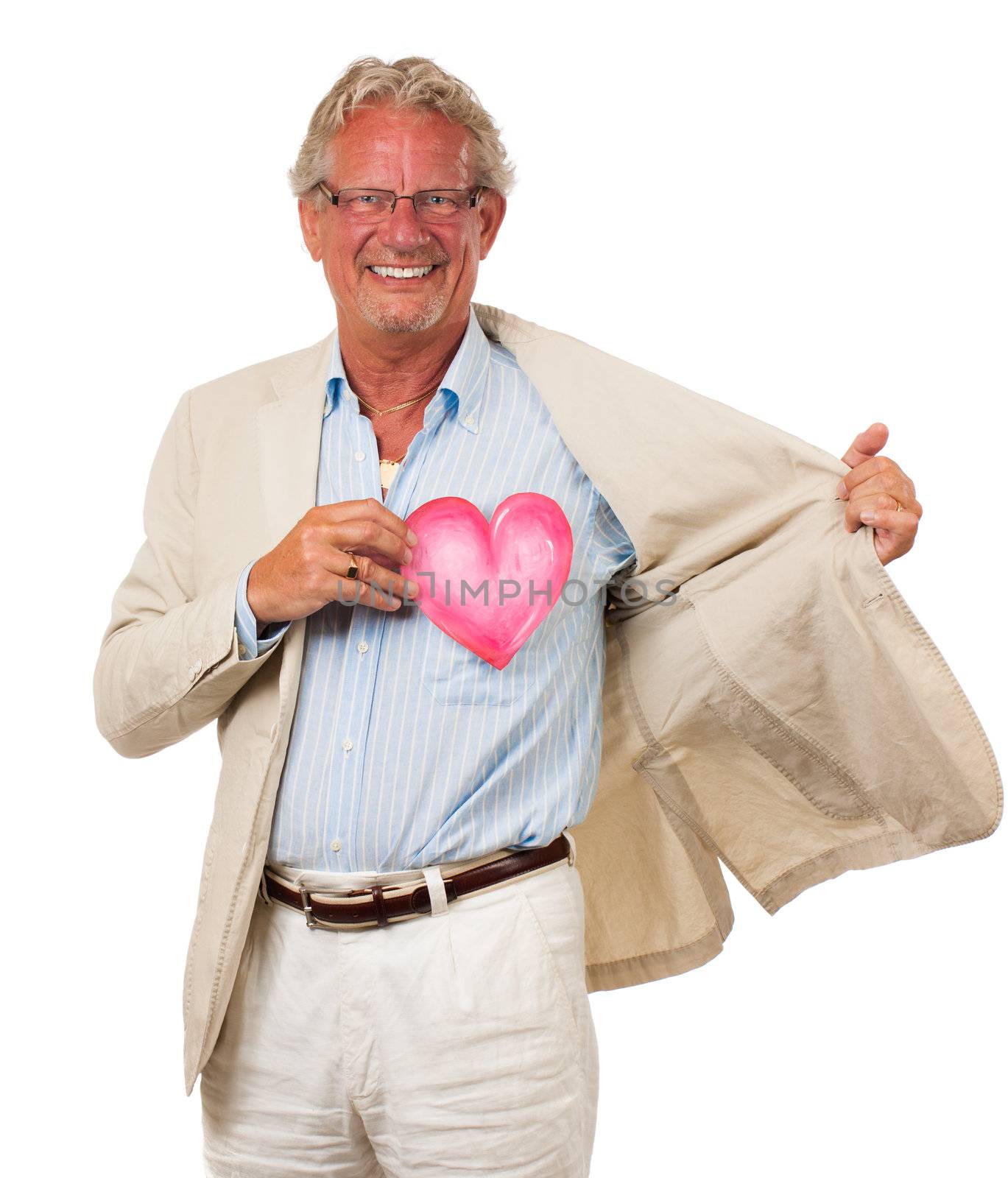 A healthy happy man holding up a love heart in front of his heart. Symolizing love and health. Isolated on white.