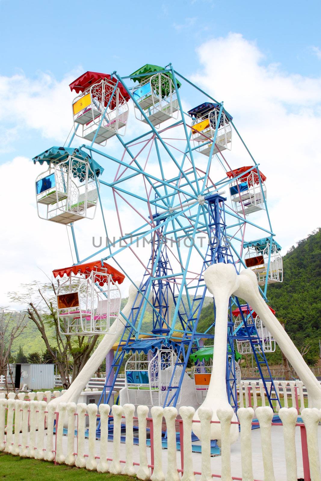 a colourful ferris wheel in the park