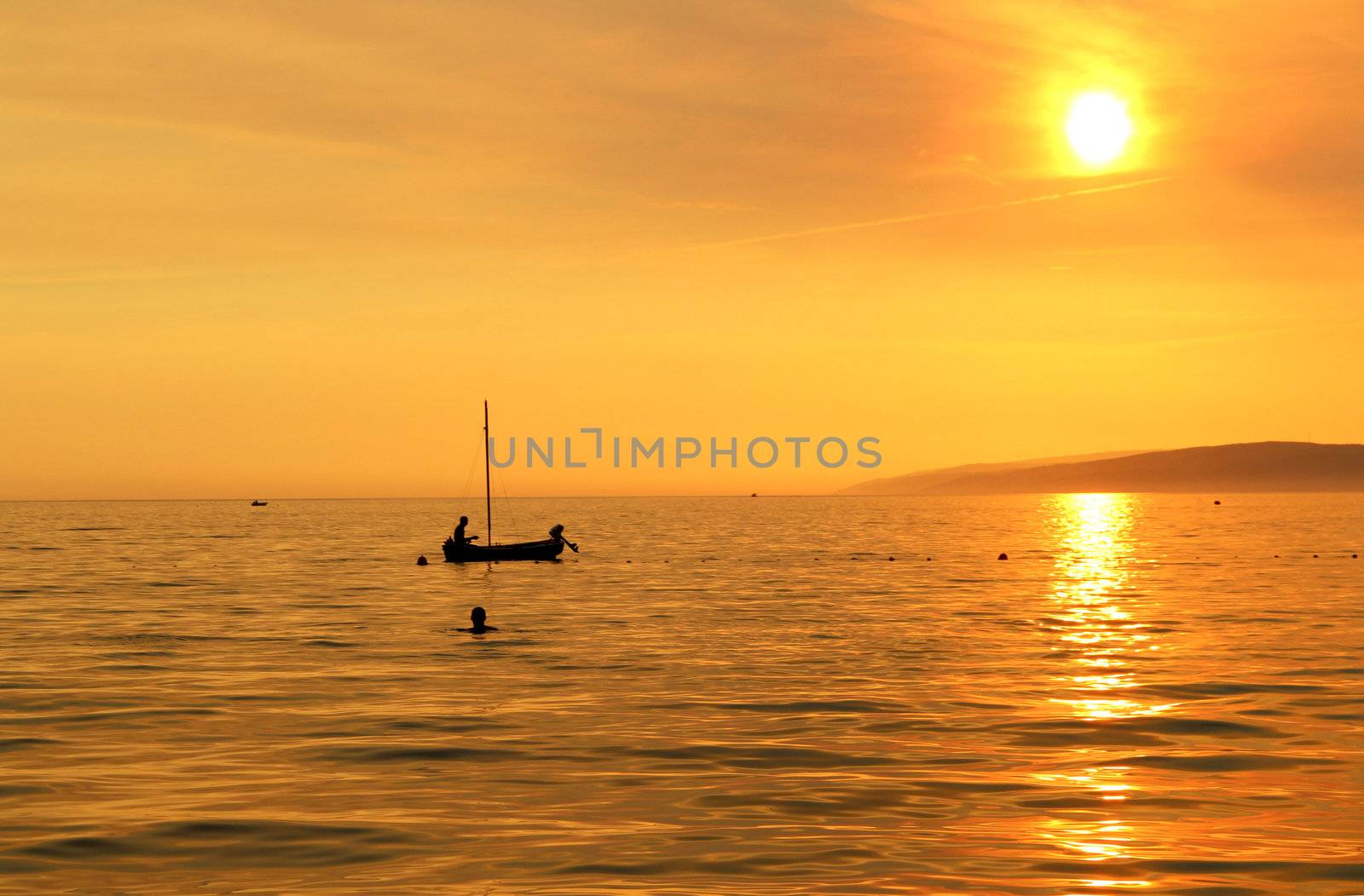 Wonderful sea sunset in Croatia and ship silhouette 