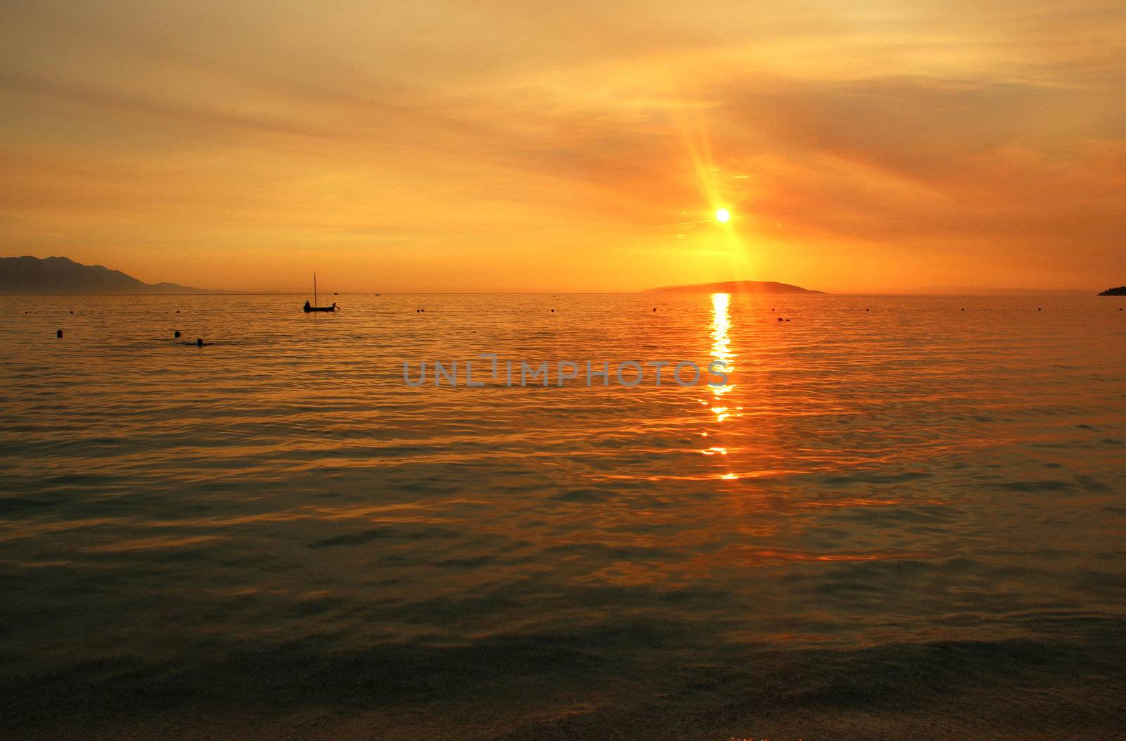 Wonderful sea sunset in Croatia and ship silhouette 