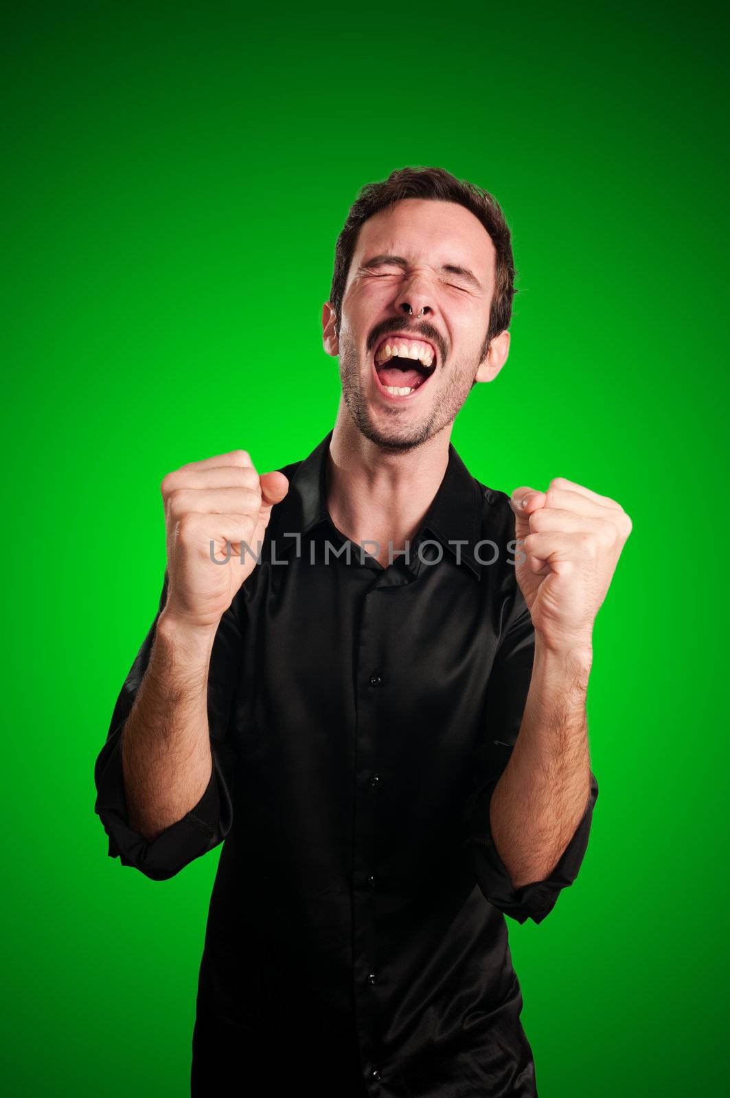 successful business man screaming on blue background