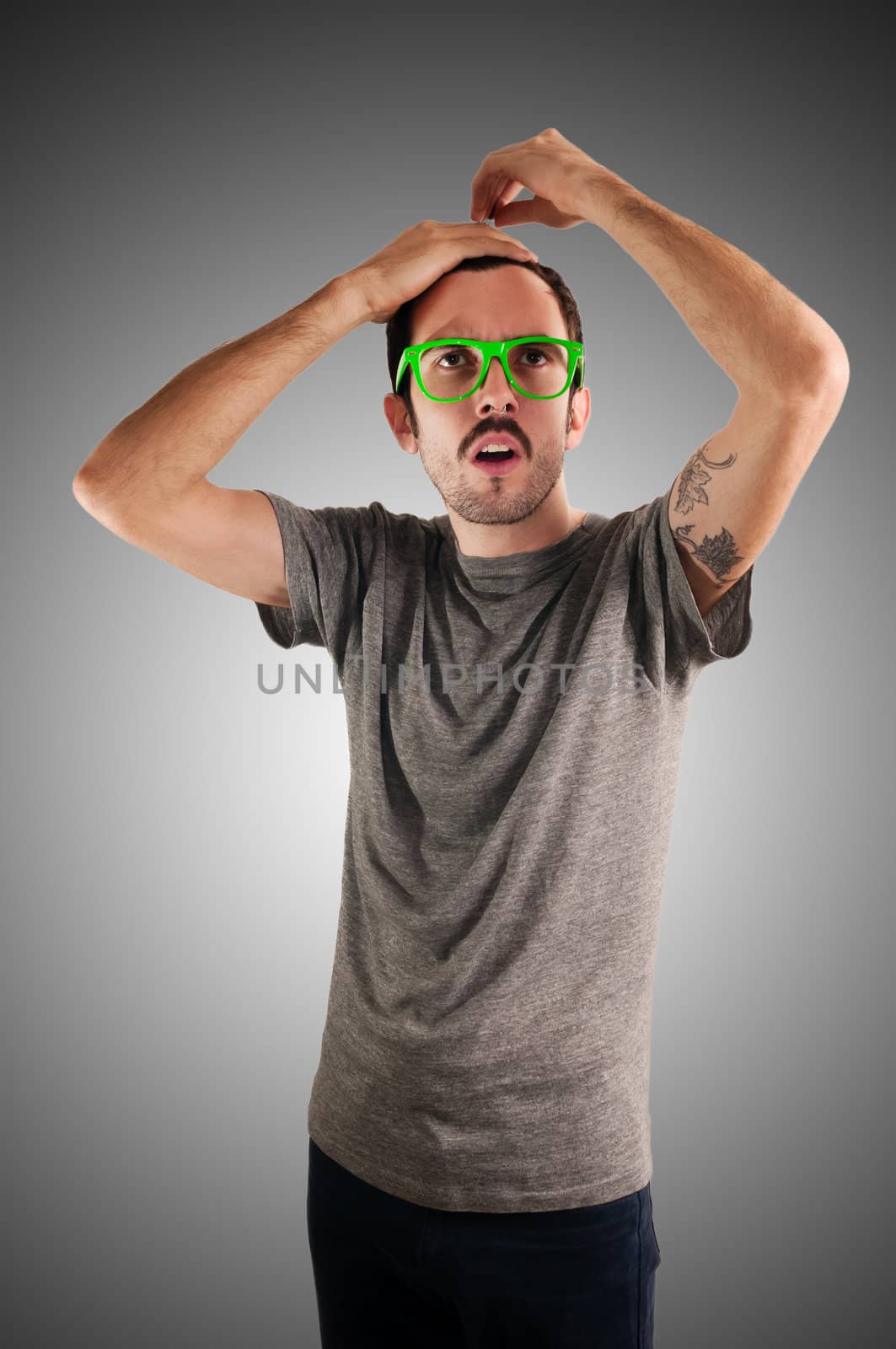 guy with green eyeglasses and mustache on green background