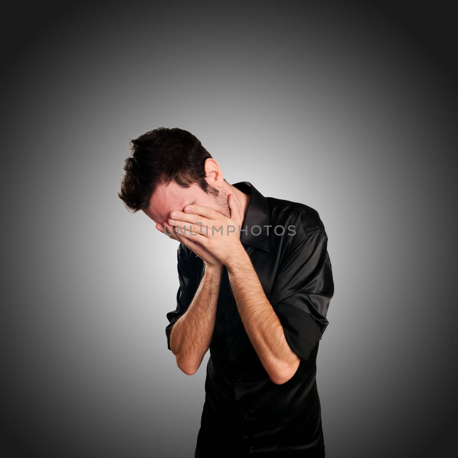 desperate man on gray background