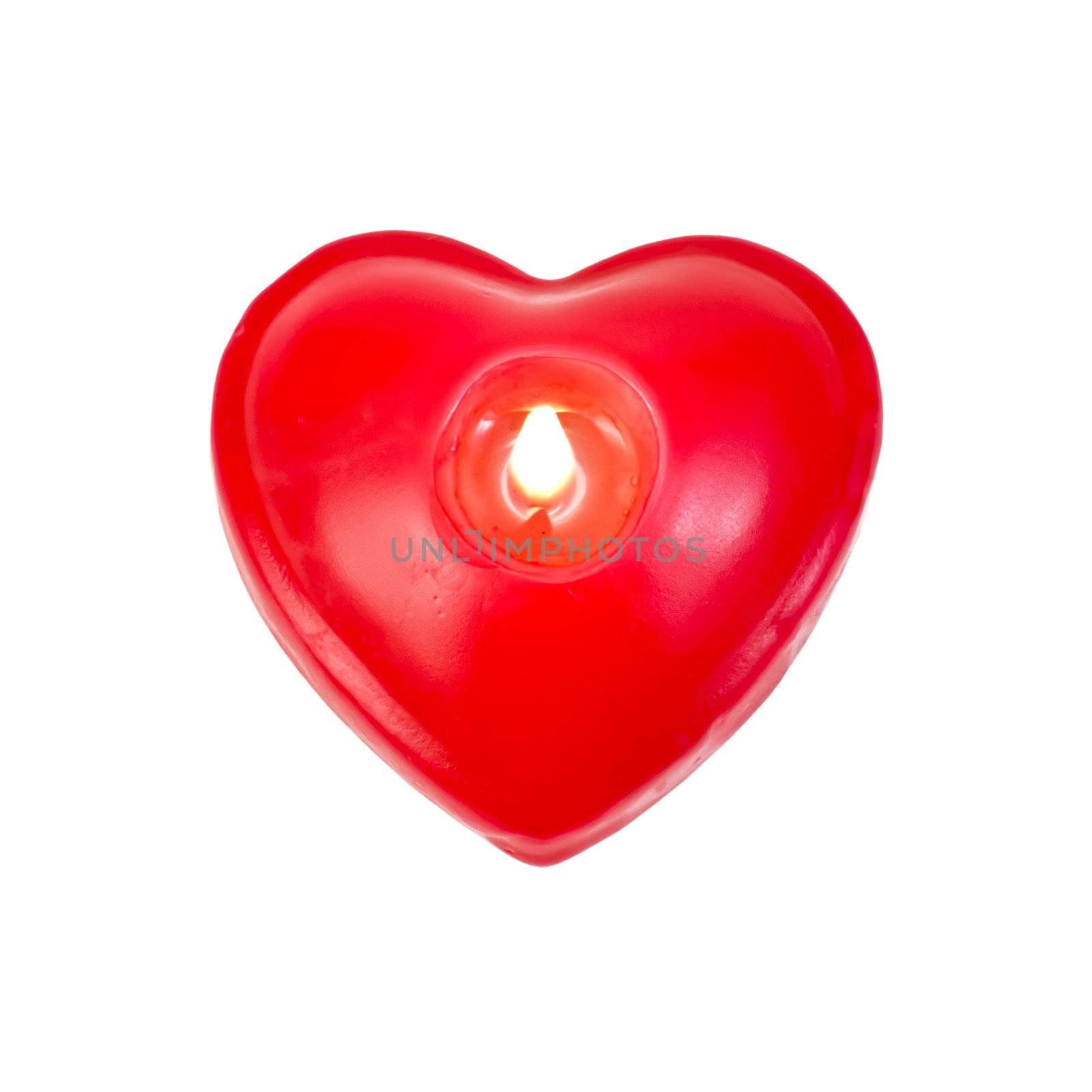 One candle burning in heart shape isolated on white background