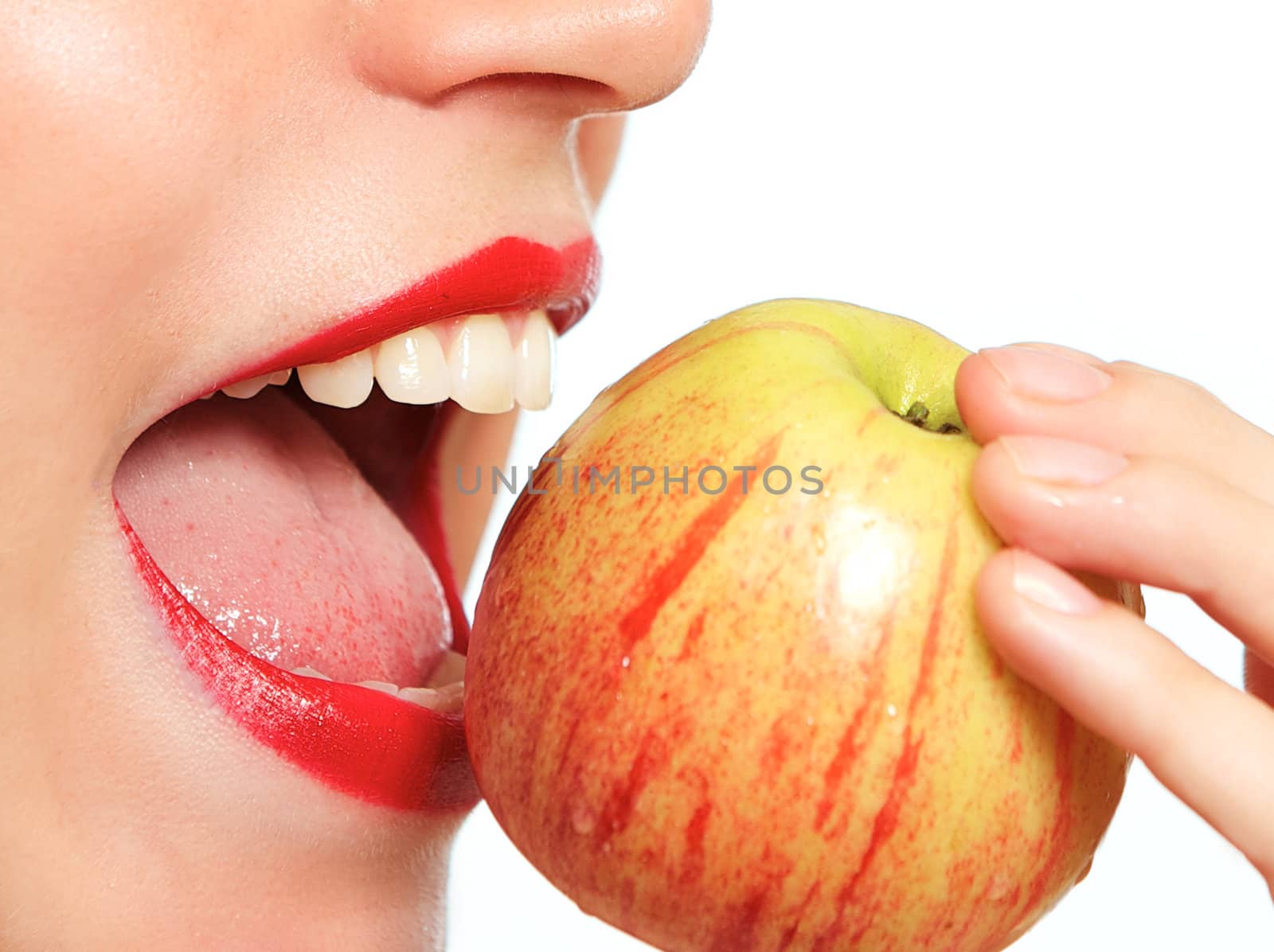 Woman biting apple up close
