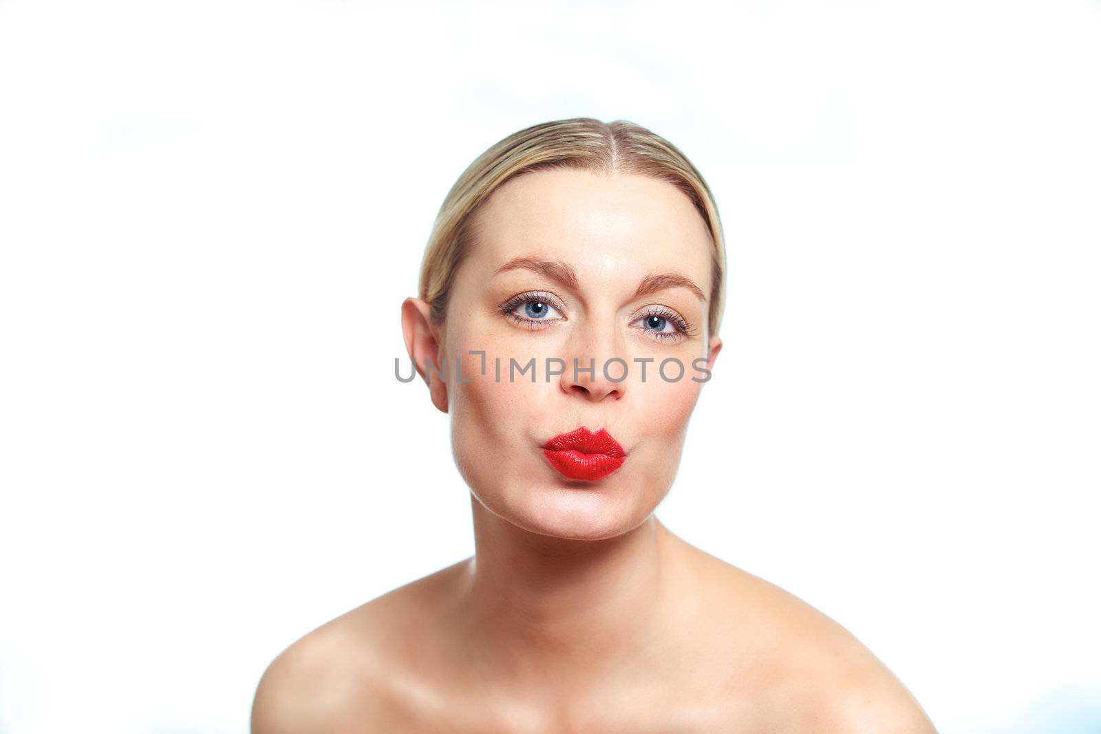 A young female blonde model pouting for the camera.