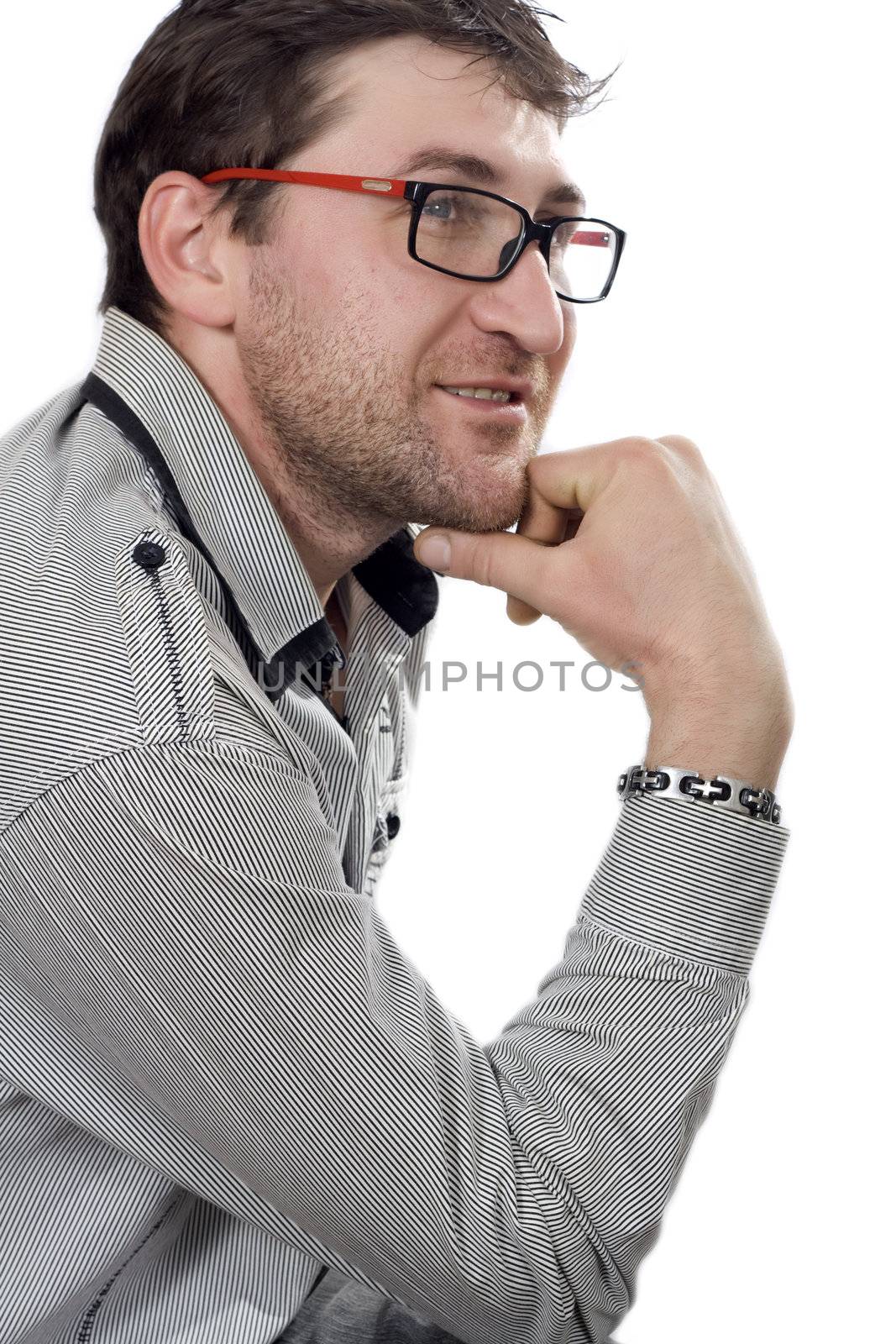 Satisfied smiling businessman in an outdoors environment..
