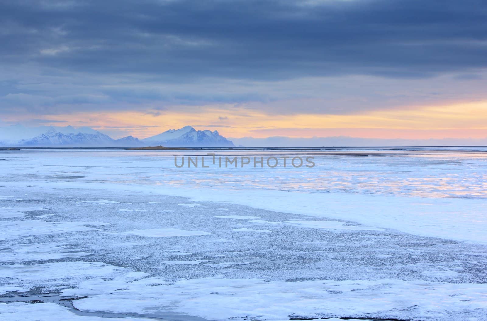 Iceland sunset and Ice shapes in the east fjords iceland at sunset in winter