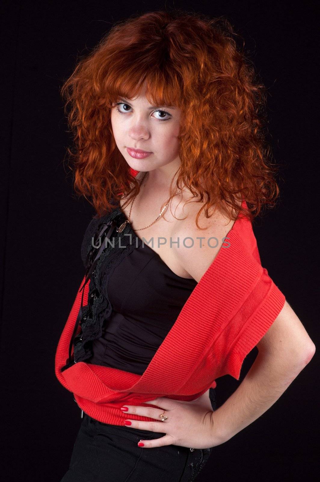 beautiful red hair woman in red dress on black