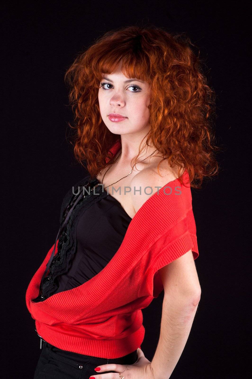 redhead girl torso shot on black background