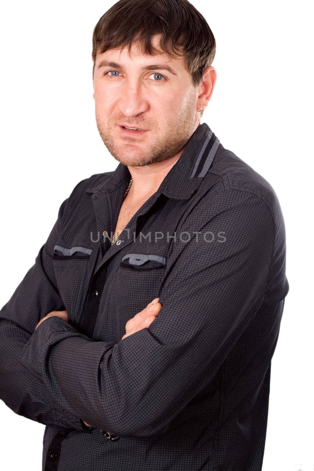 An attractive young business man posing against white background
