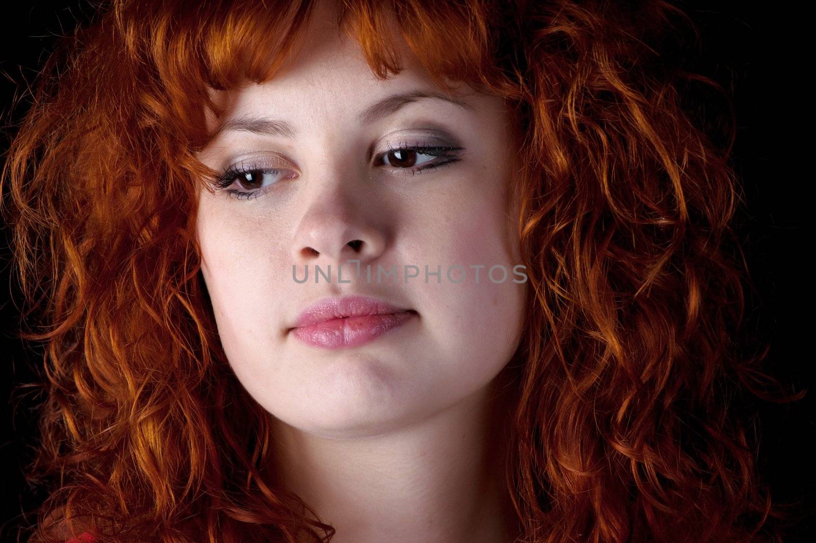 Closeup portrait of beautiful redhead woman