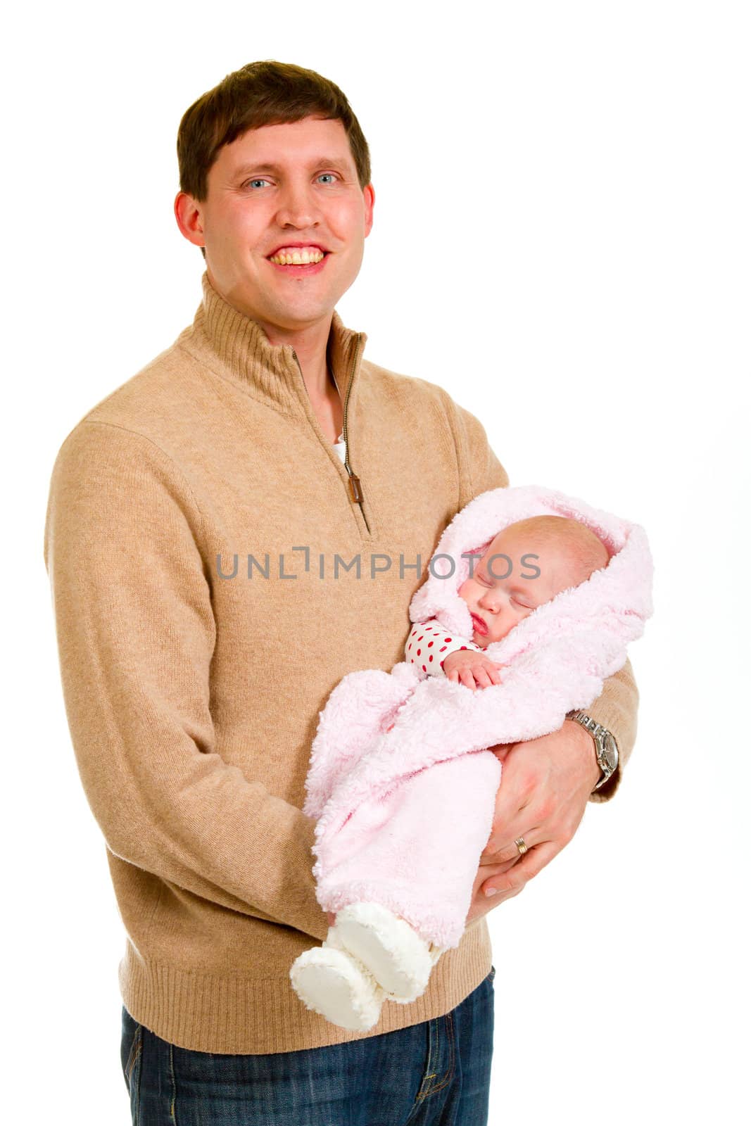 A family portrait of three people in the studio including mother father and newborn baby girl.