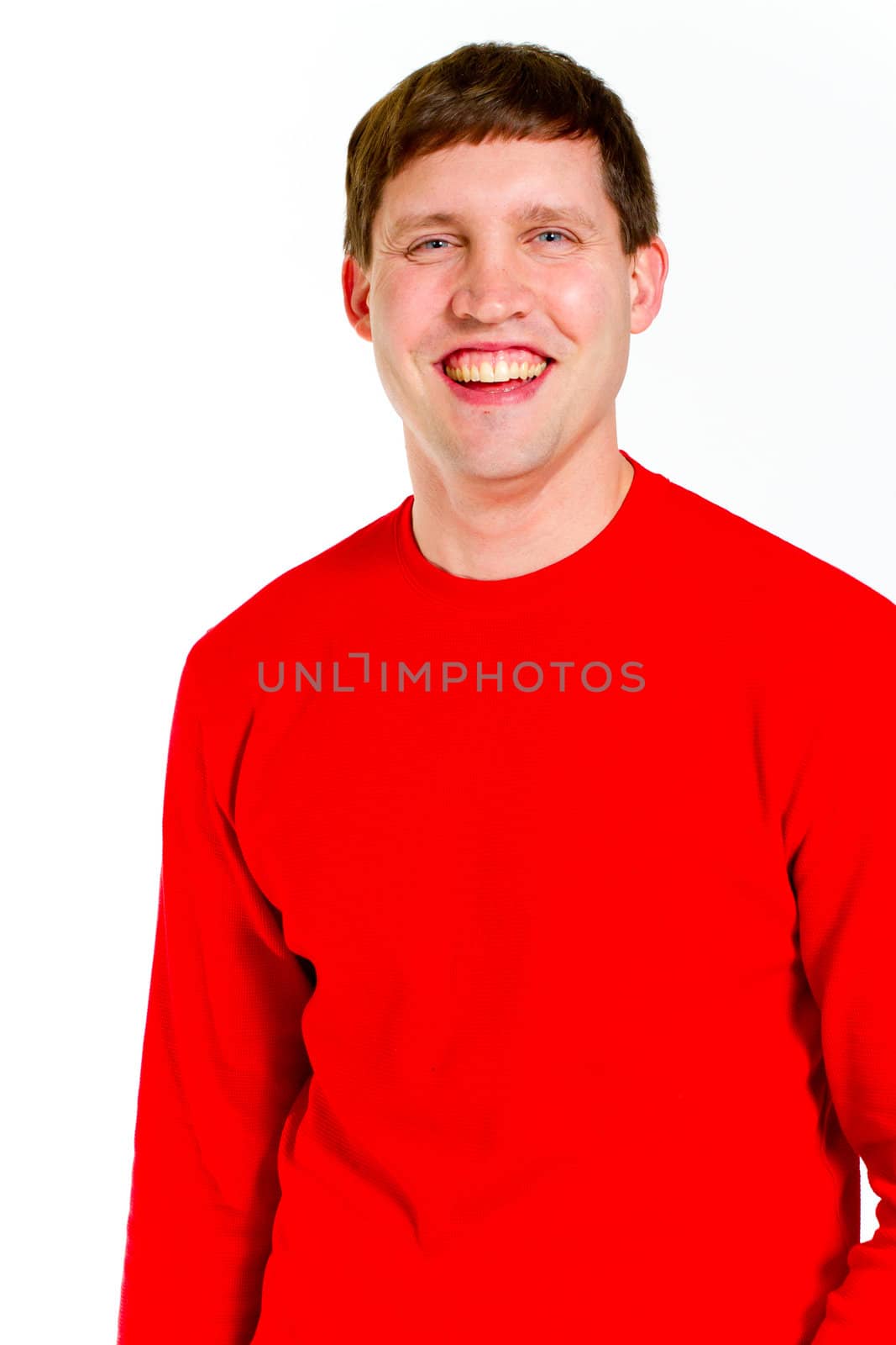 An attractive man is photographed against a white background in the studio for this portrait.