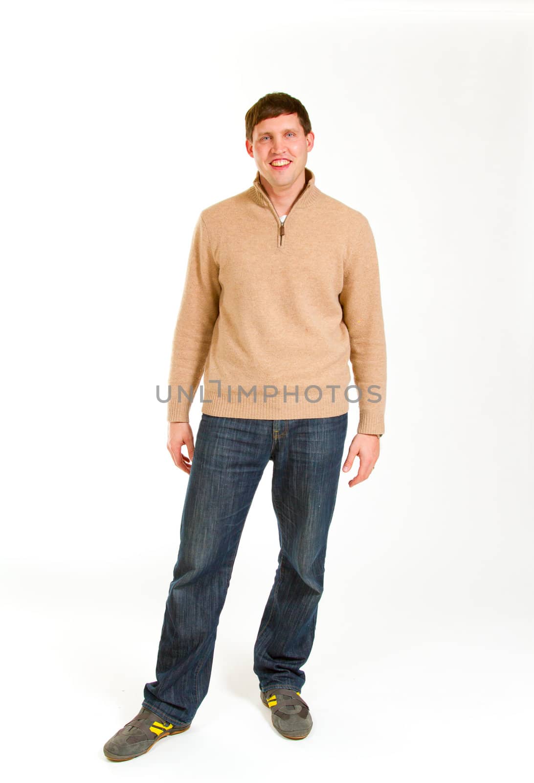 An attractive man is photographed against a white background in the studio for this portrait.