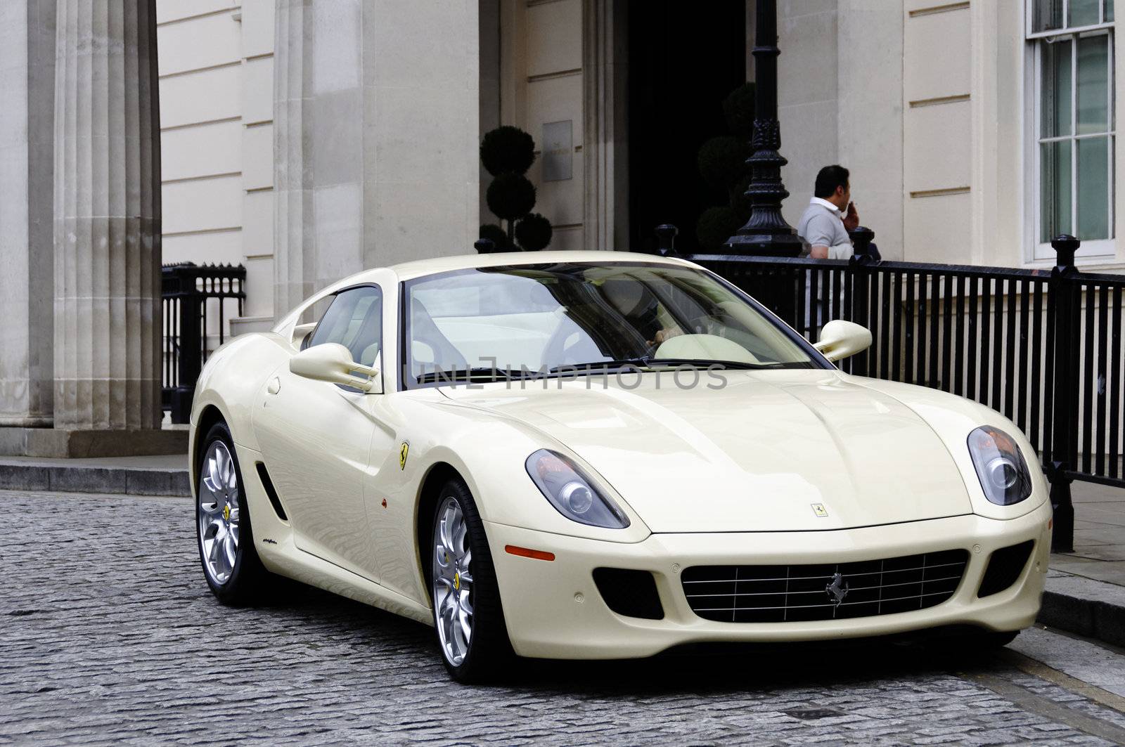 A Ferrari 599 GTB Fiorano in front of the Lanesborough hotel in London