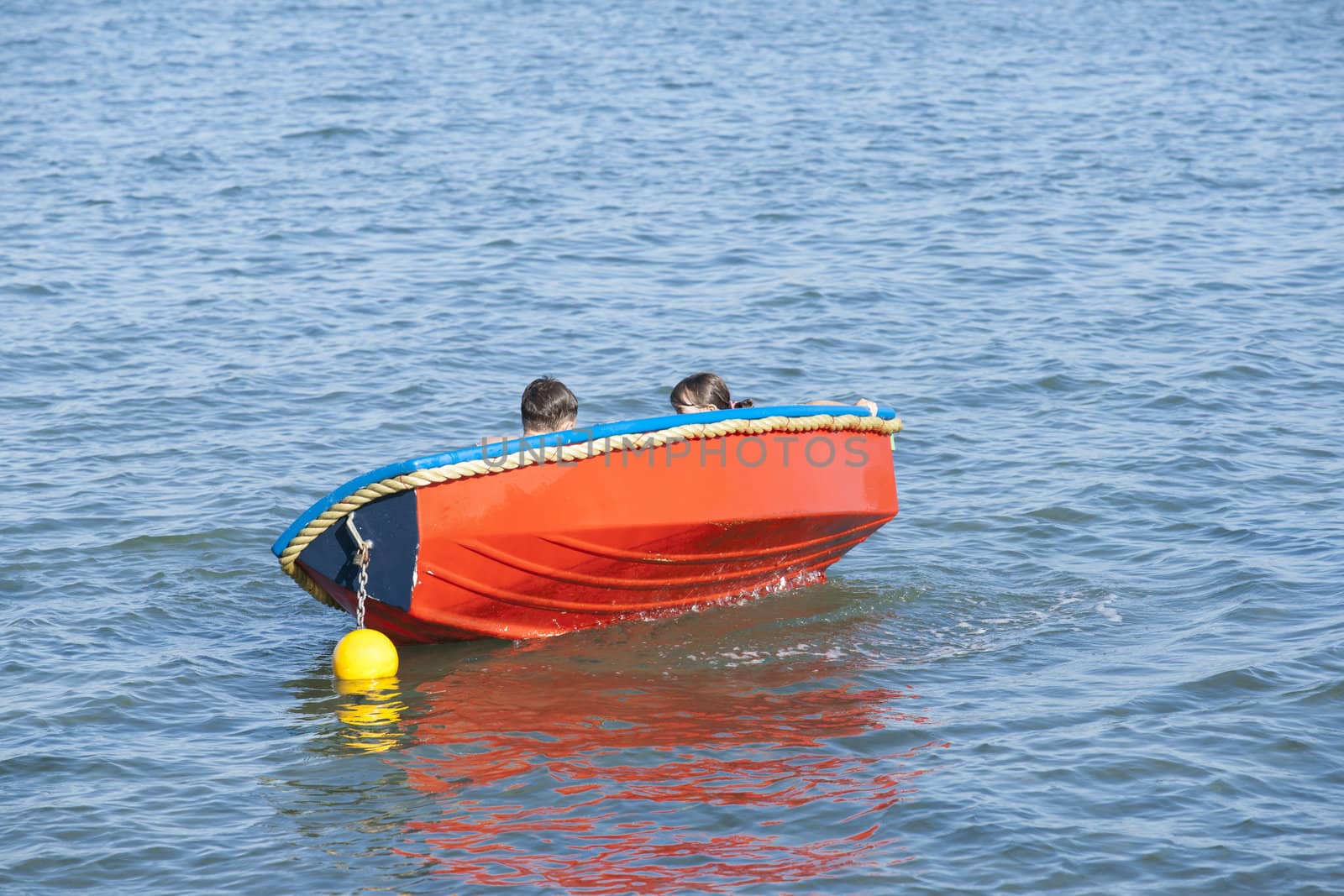 Children hidden in a rocking boat.