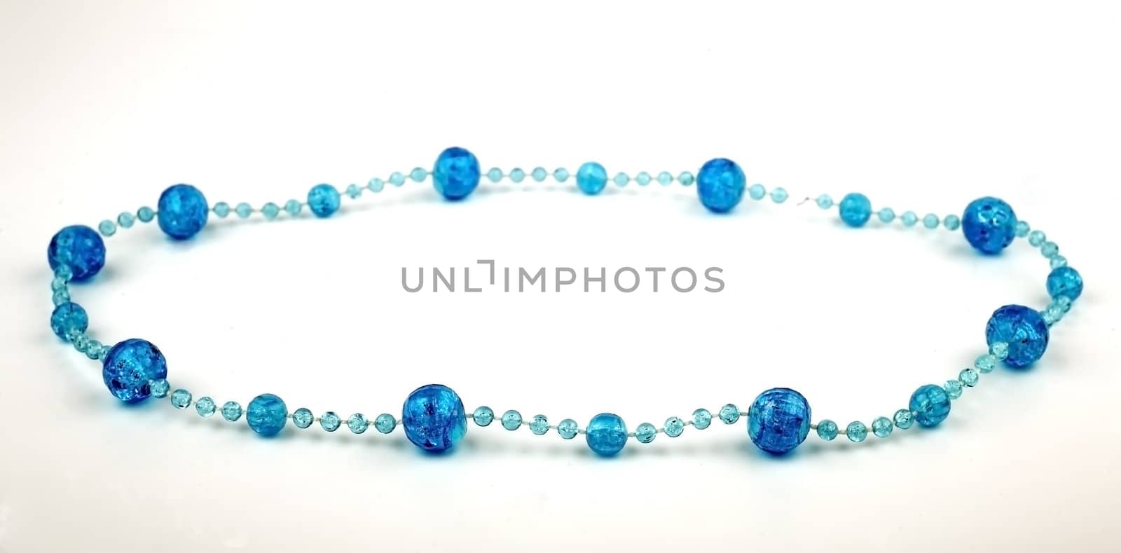 Women's jewelry, blue beads, isolated on a white background