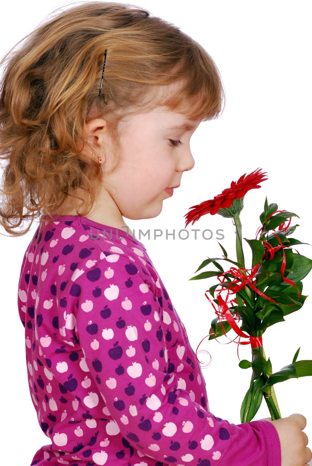 Beauty little girl with flower studio shot