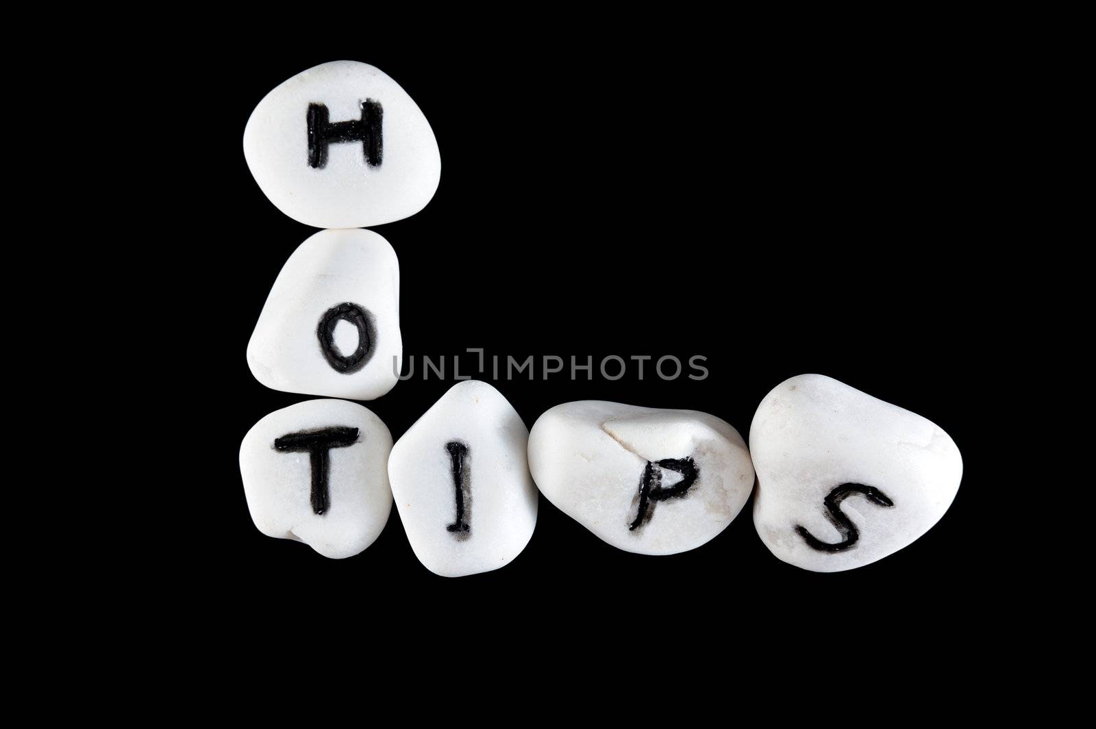 Hot tips words carved on group of stones