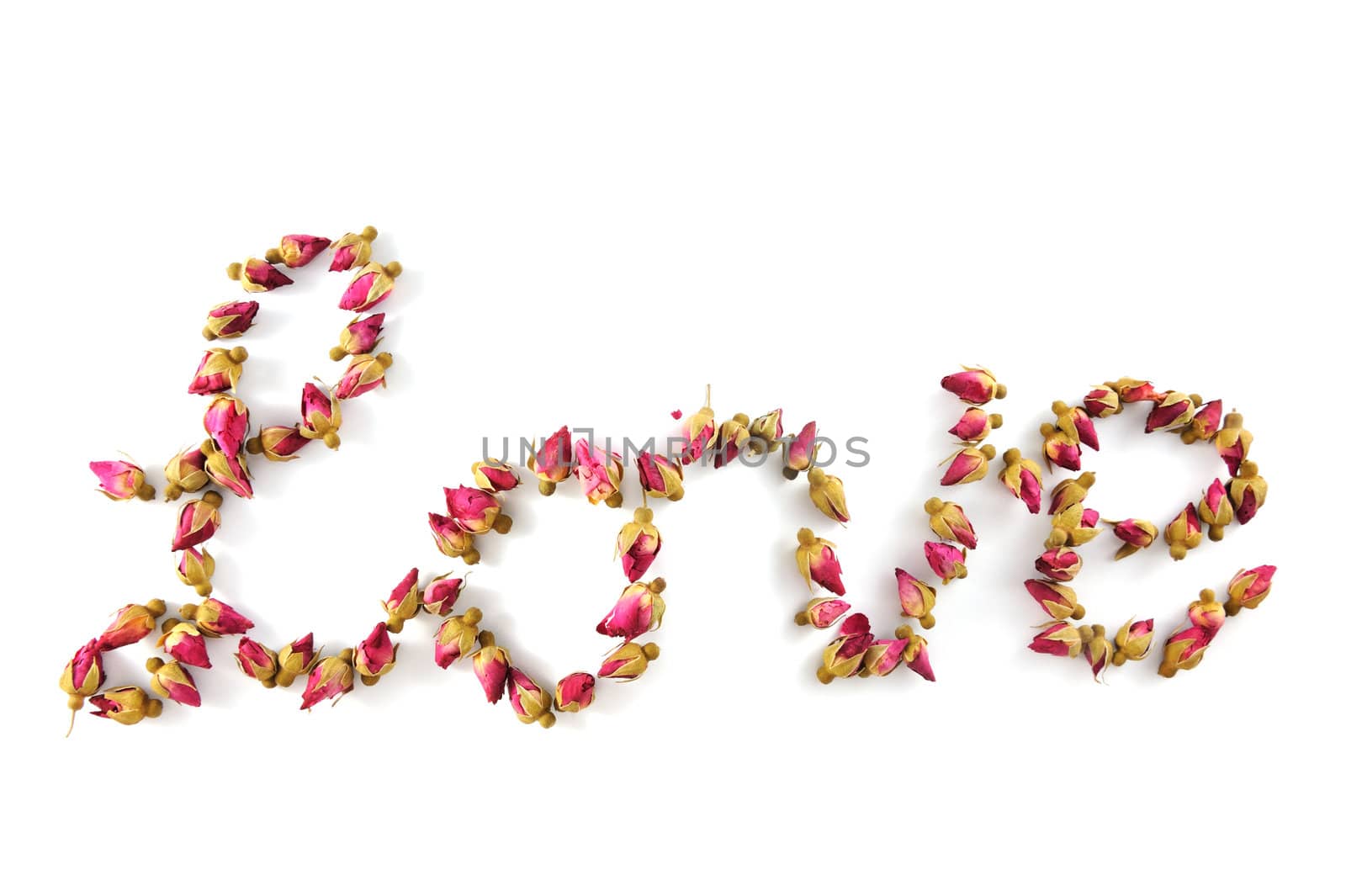 Love word made of dried flowers on white background