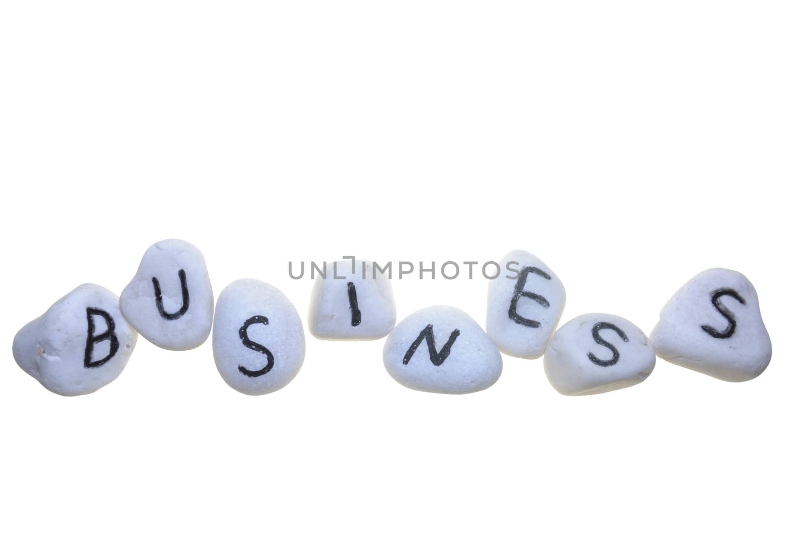 Business word on stones and isolated on white background