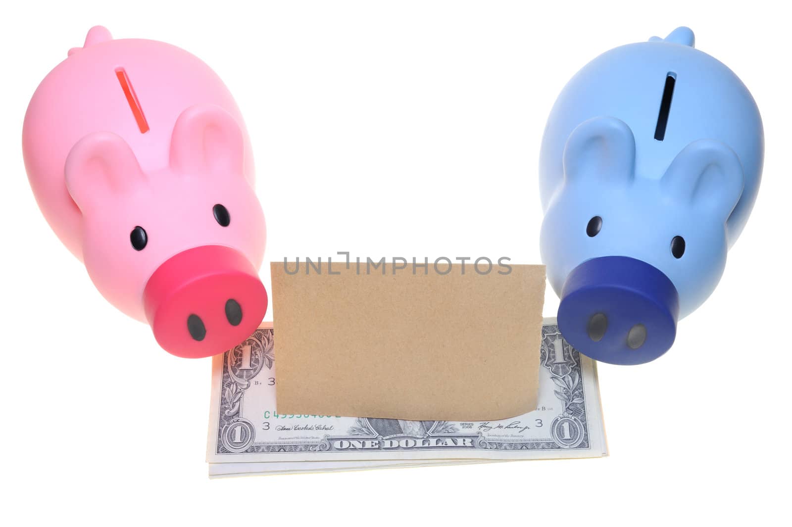Two piggy banks standing side by side with dollar bills and a blank paper