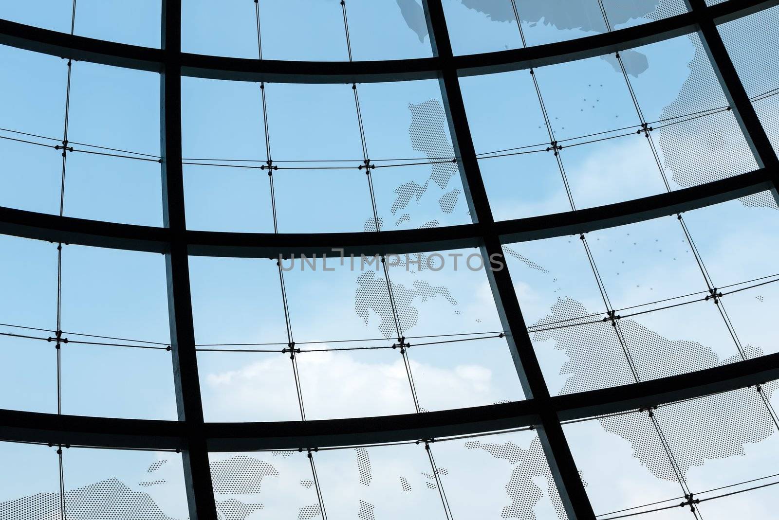 Huge sphere glass window frame with blue sky as background