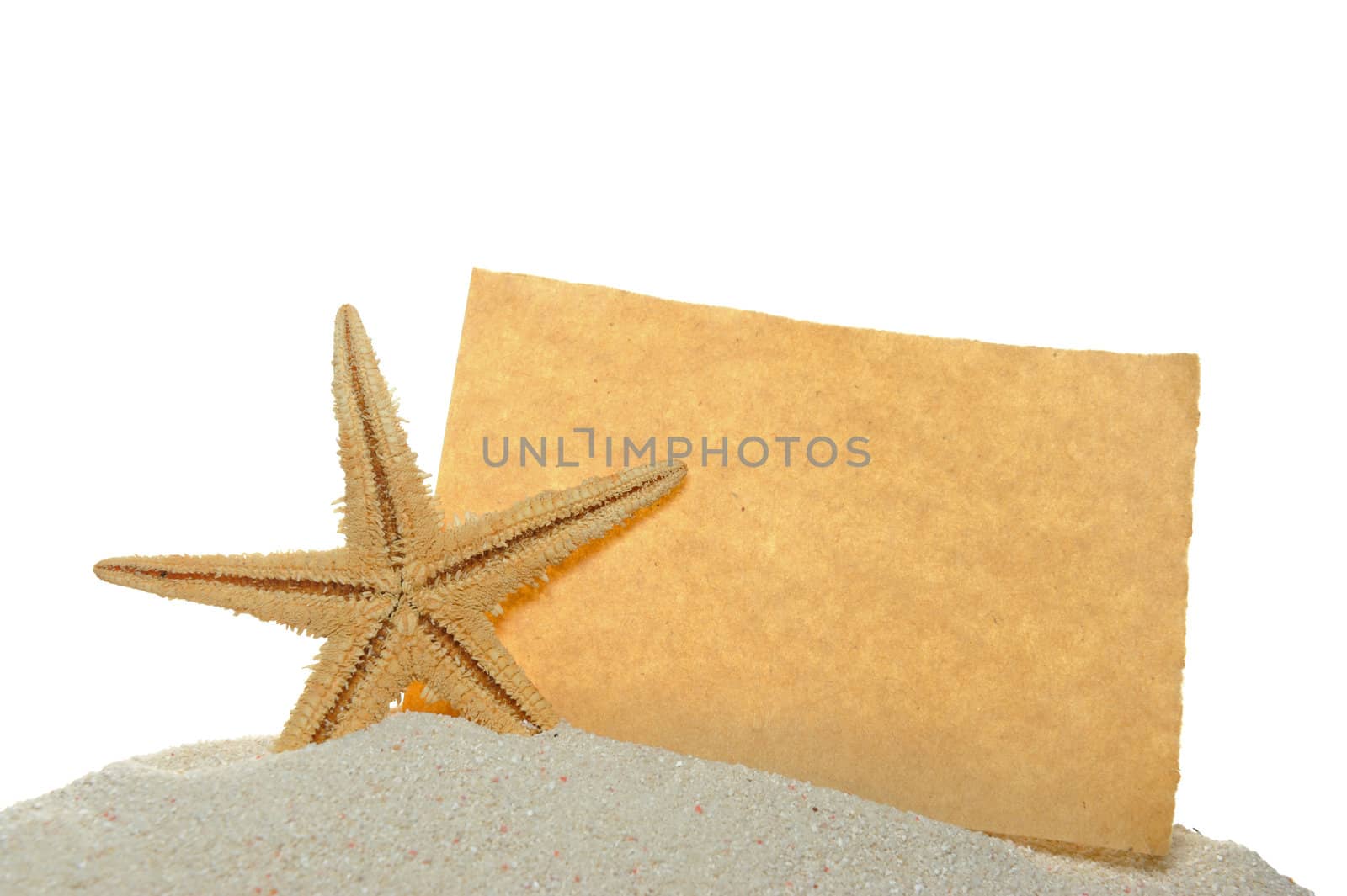 Starfish and old paper on sand by raywoo