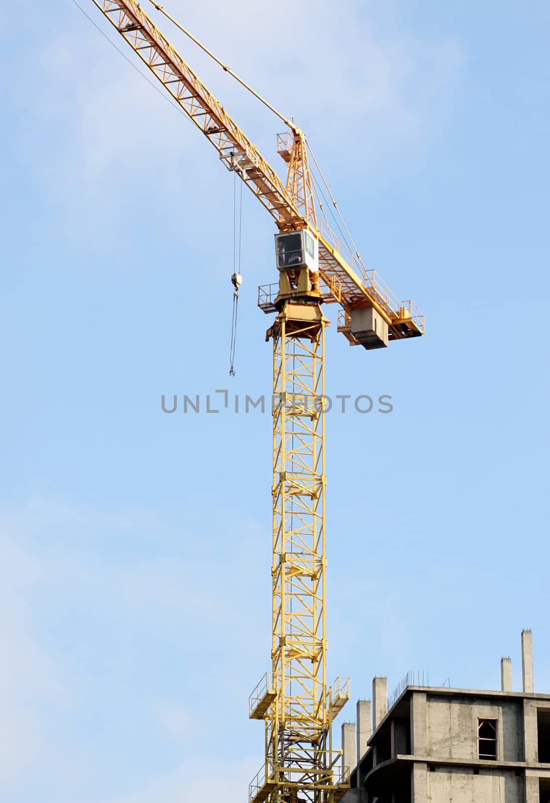 building crane over blue sky