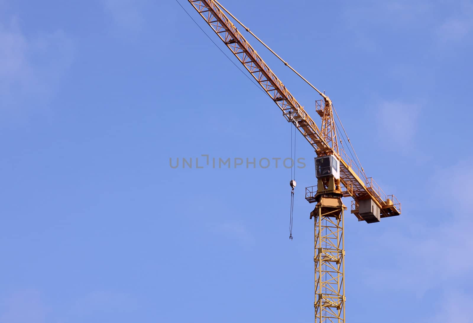 building crane over blue sky