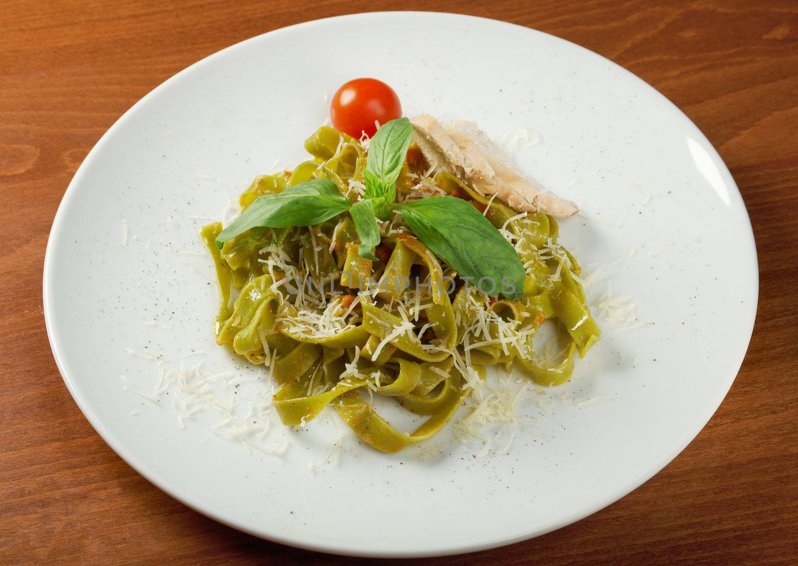 Pasta tagliatelle with pesto sauce basil and grated parmesan
