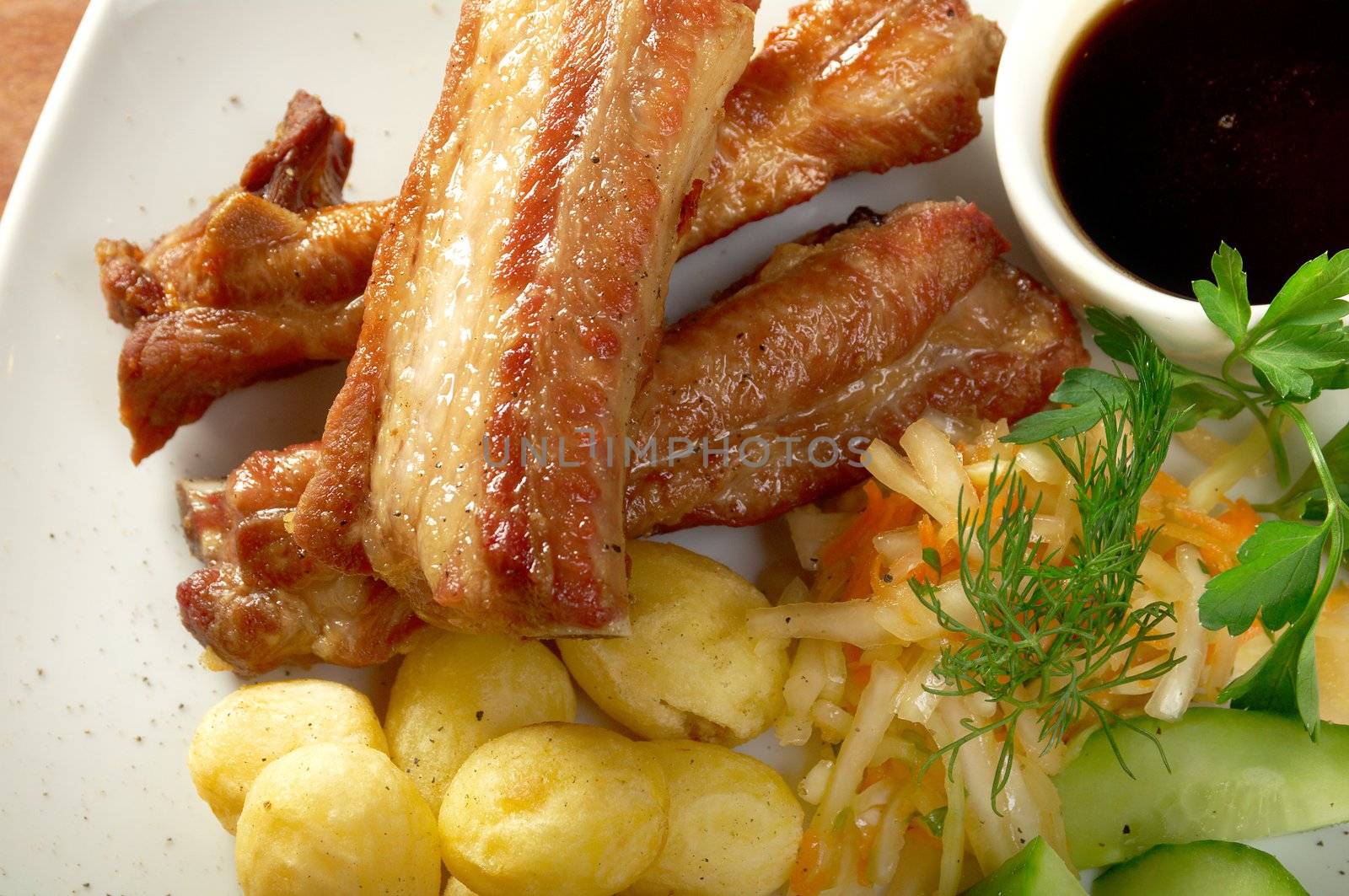 barbecued pork ribs and vegetables.Shallow depth-of-field. 