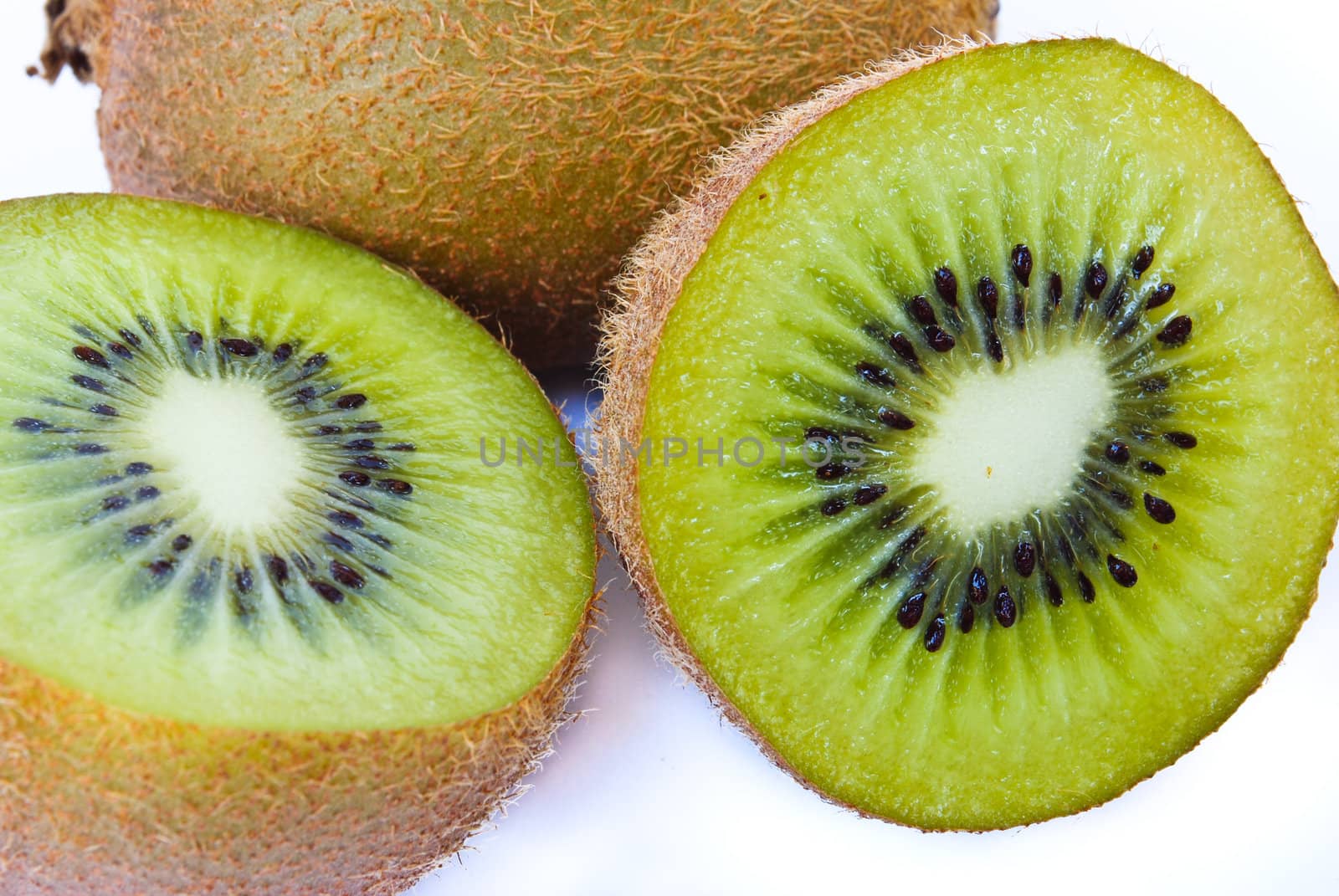 Kiwi fruit sliced segments isolated on white background