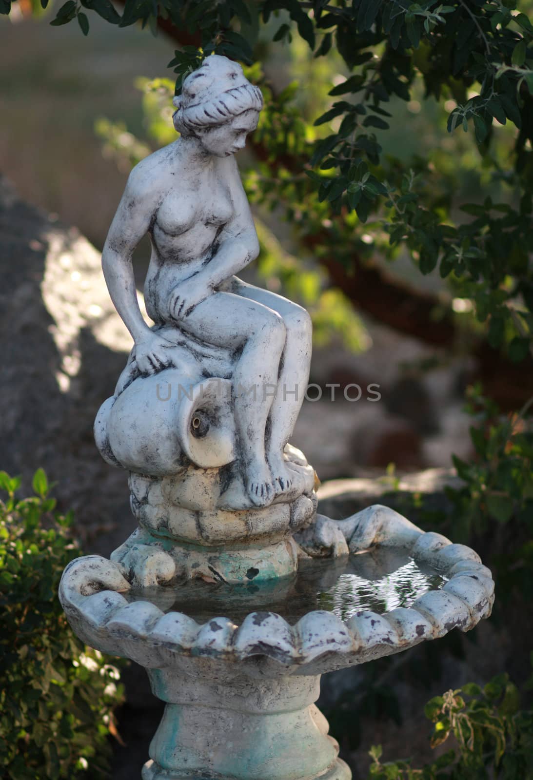 Park garden fountain statue of a woman with a jug of water by pt-home