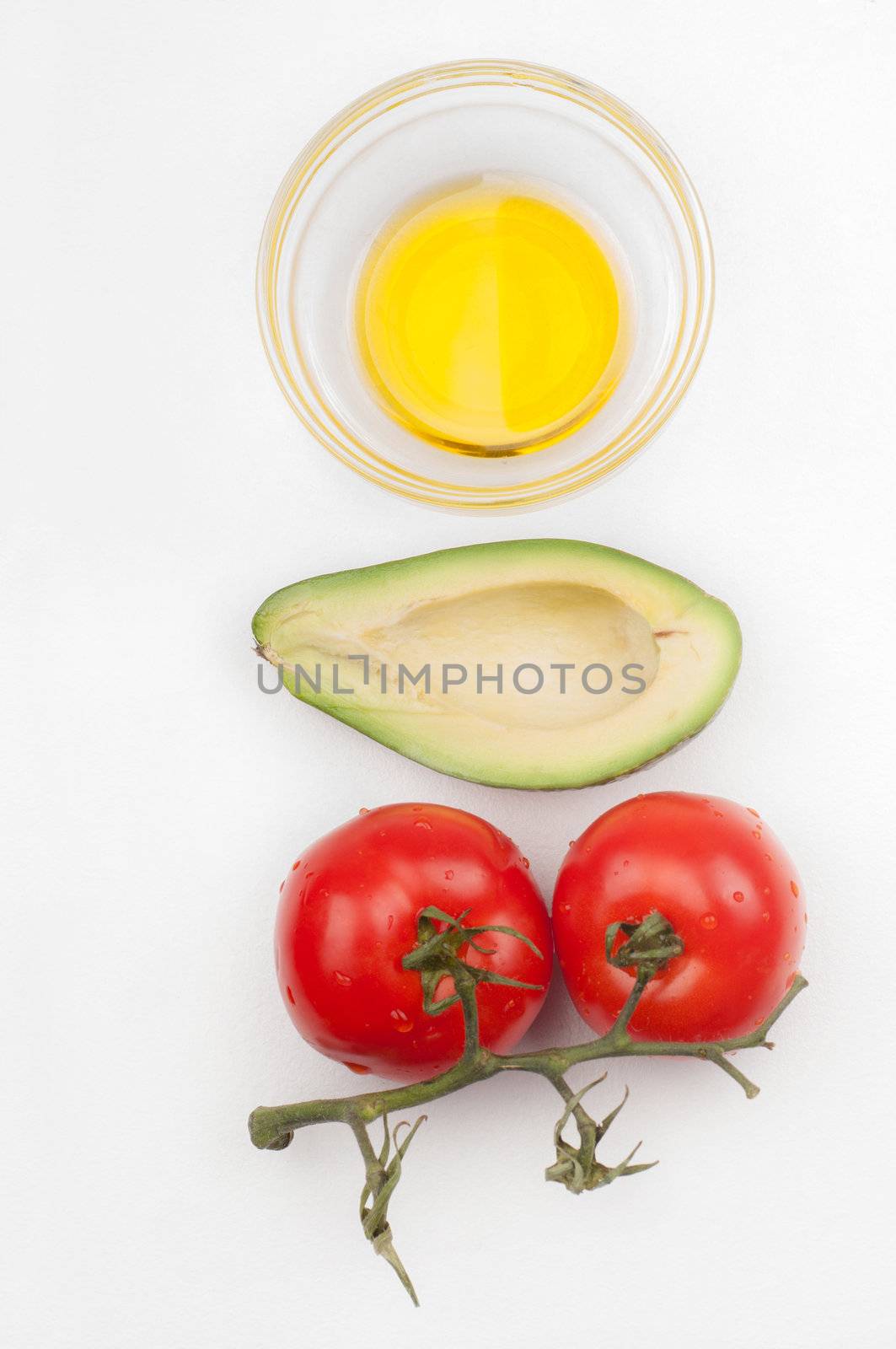 Tomatoes, avocado and olive oil - salad ingridients