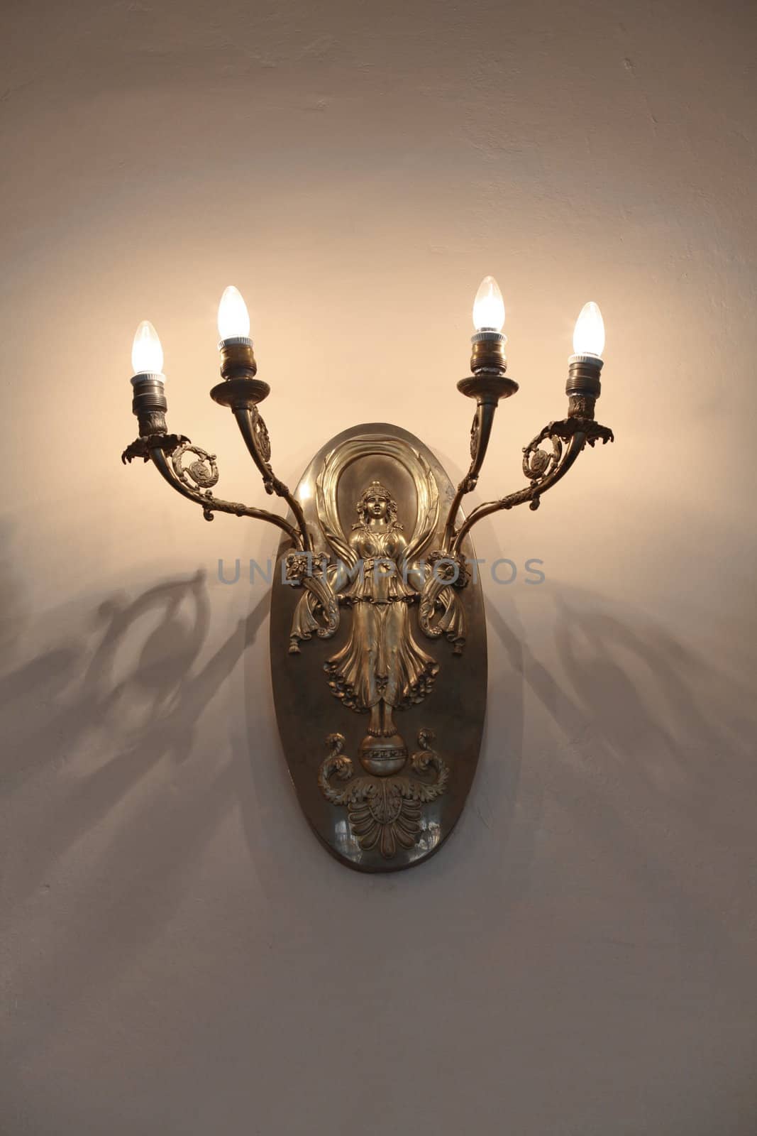 Antique candlestick on the wall